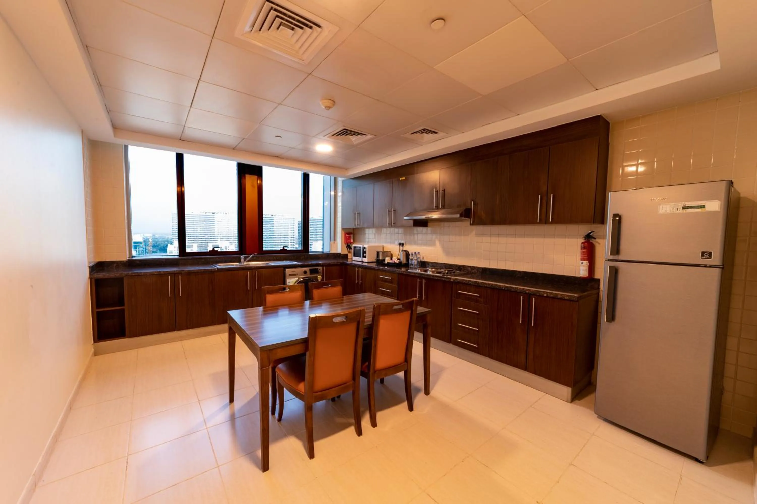 Kitchen or kitchenette in Abidos Hotel Apartment Dubai Land