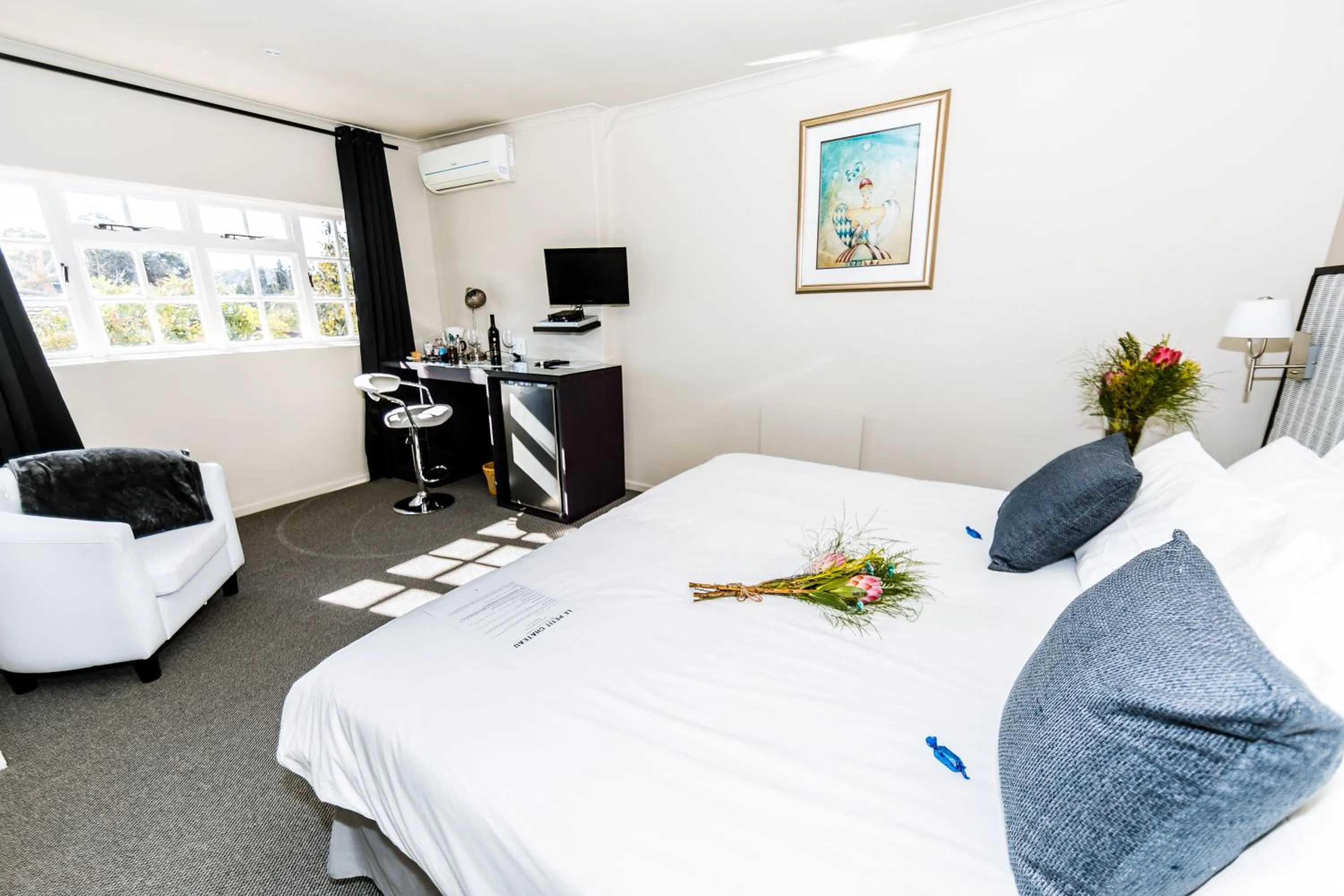 Bed in Le Petit Chateau Guest House