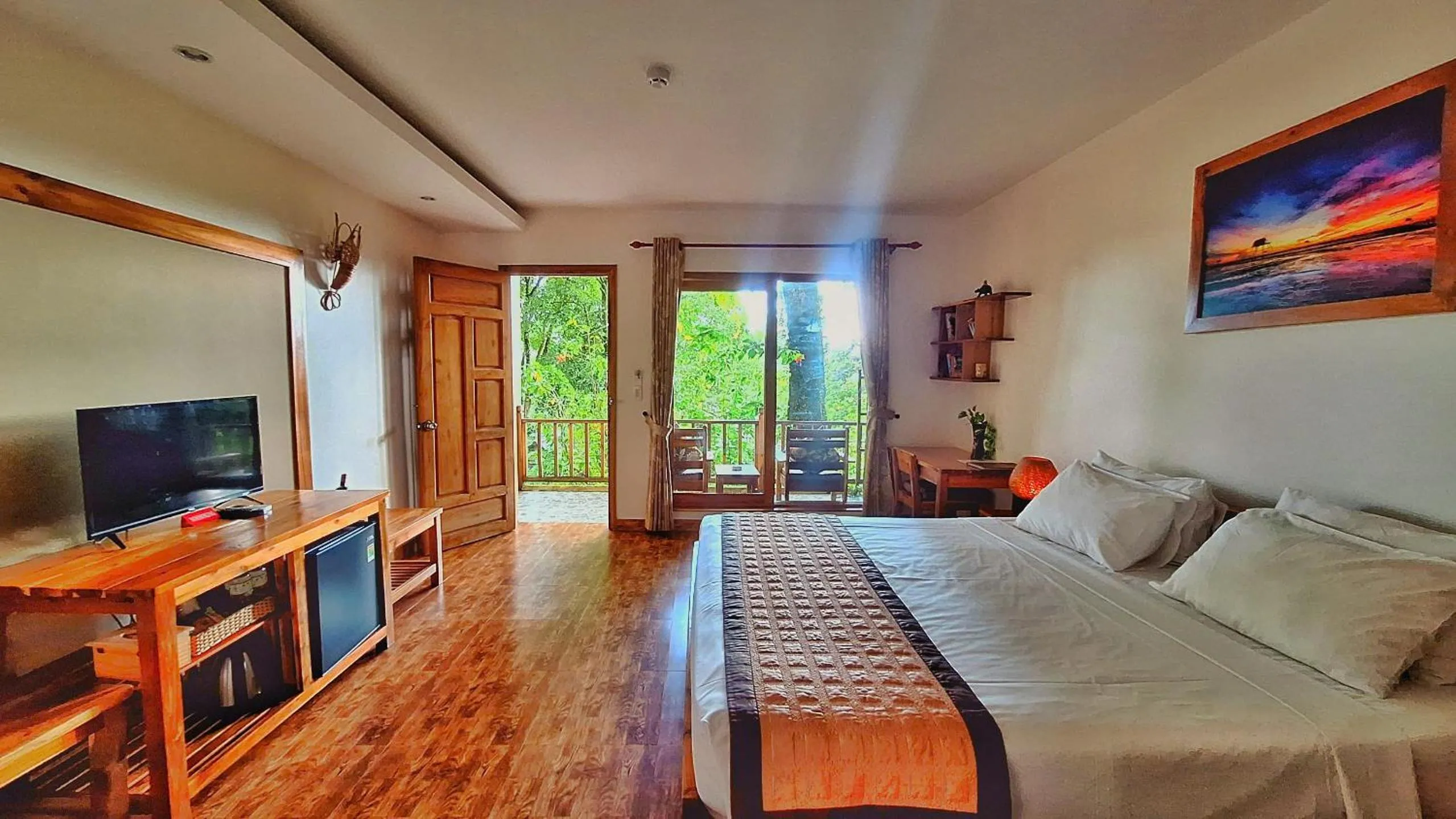 Communal lounge/ TV room, Bed in Ancarine Beach Resort