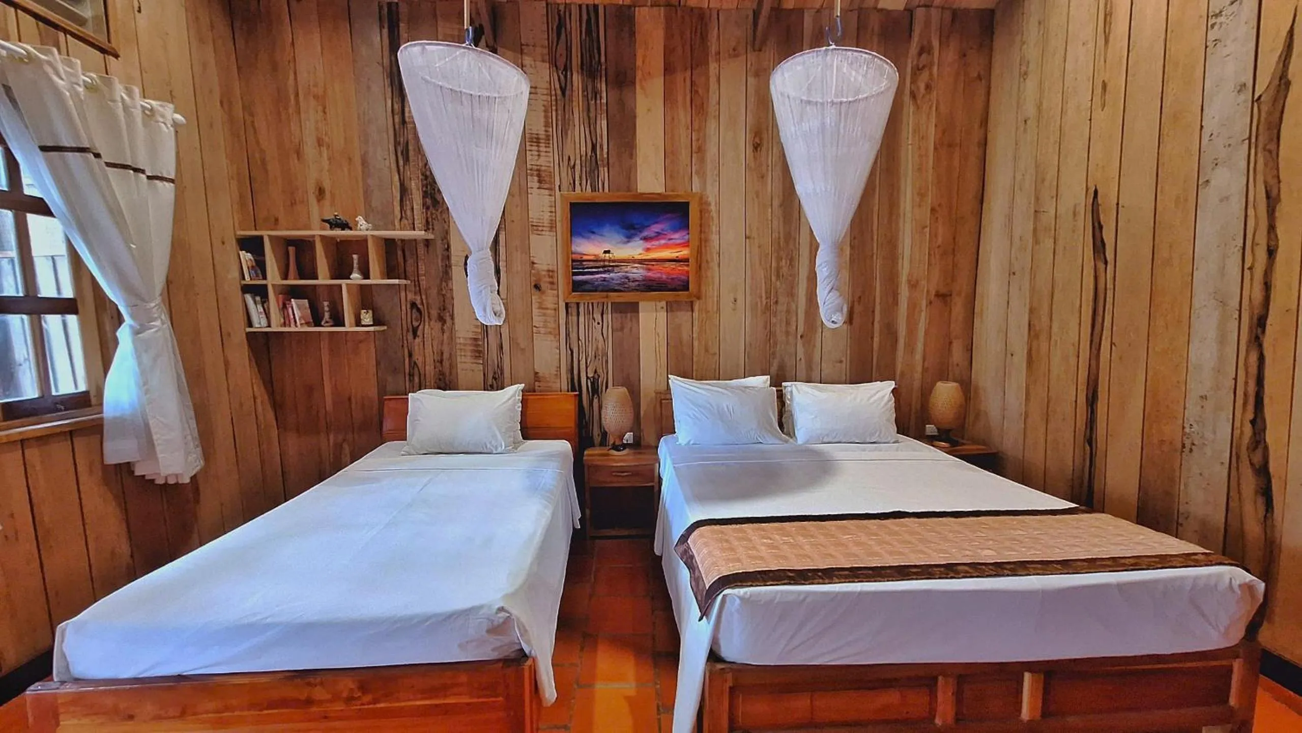 Bed in Ancarine Beach Resort