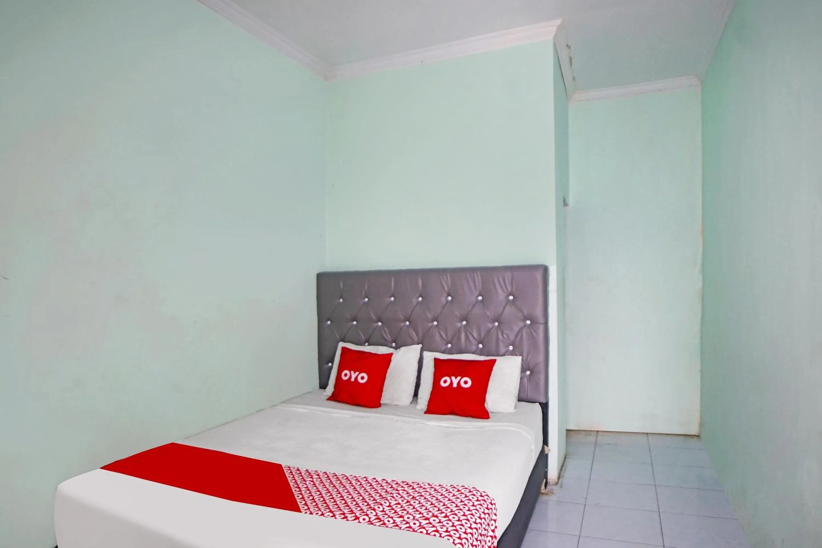 Bedroom in Hotel O Puri Dennis