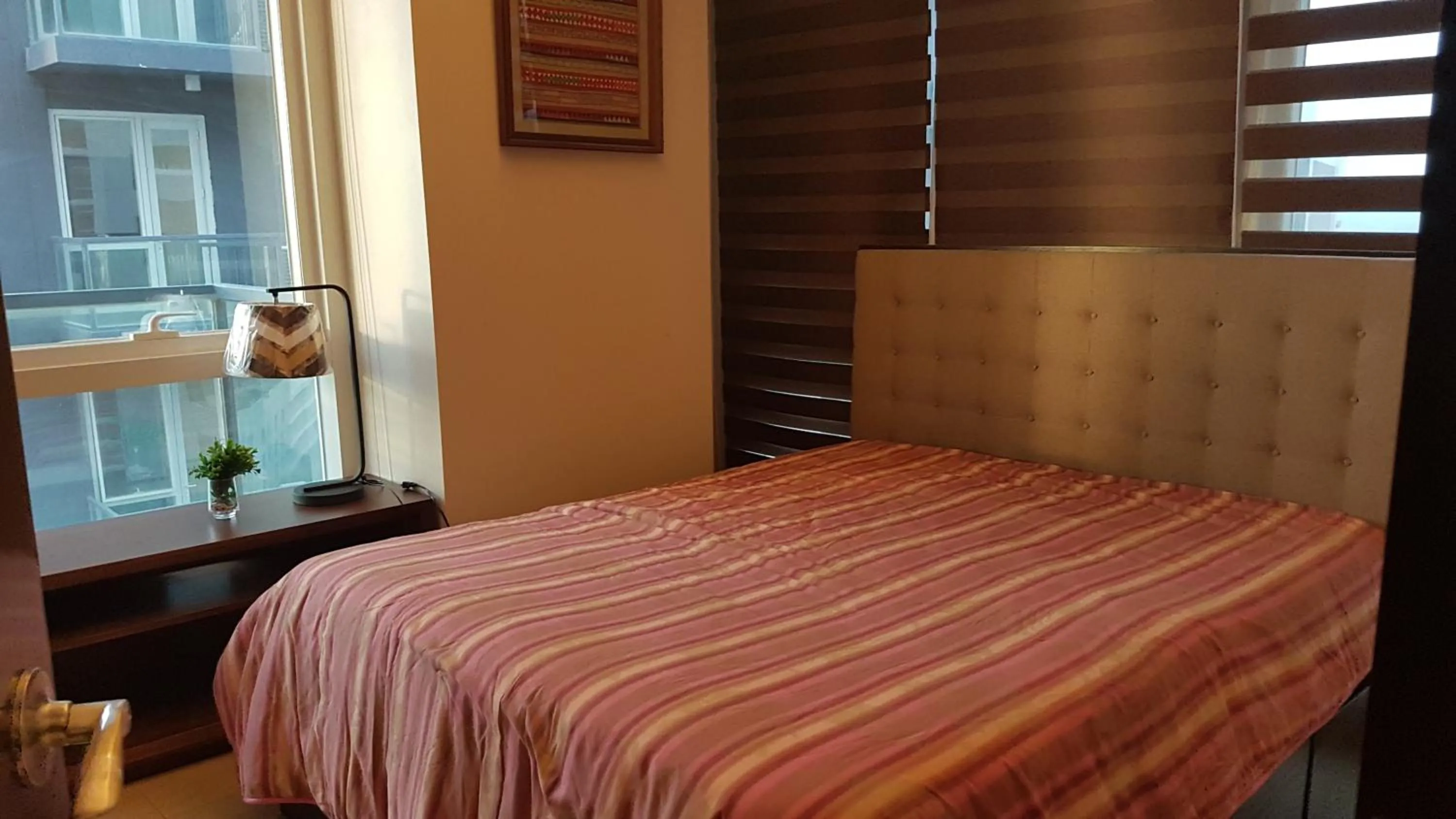 Bed in Mactan Newtown Condo with Garden and Ocean View 8NEWTOWN BLVD