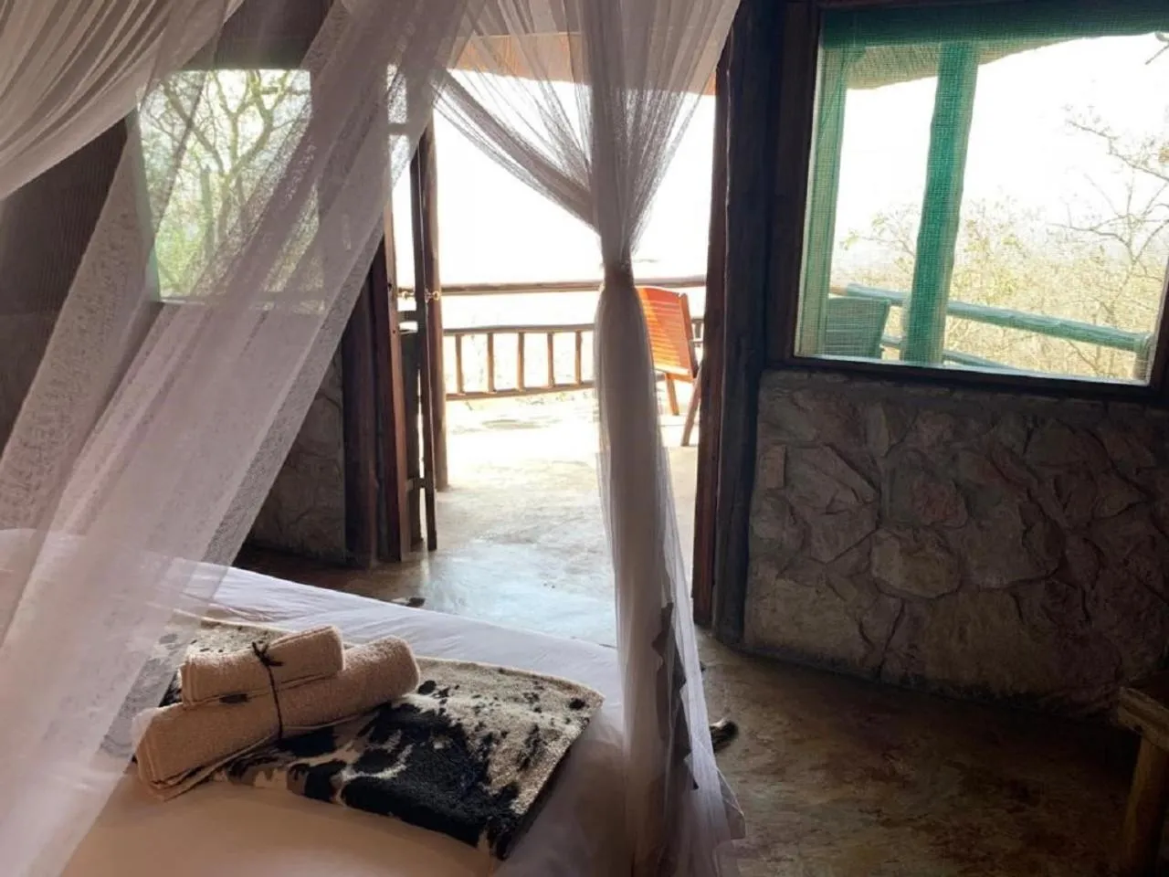 Bed in Shayamoya Tiger Fishing and Game Lodge