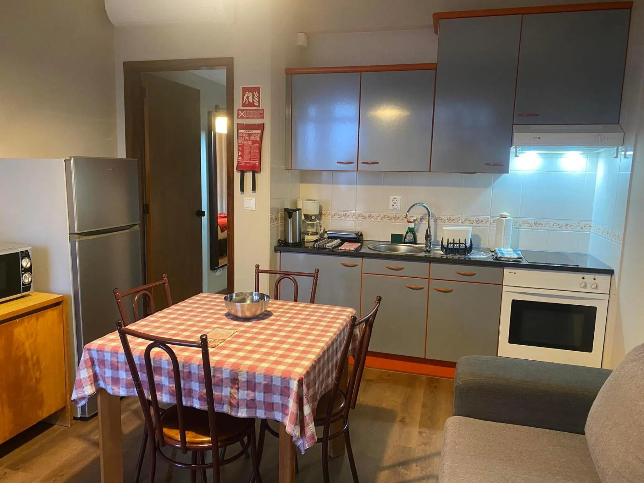 Kitchen or kitchenette in Apartamentos São João