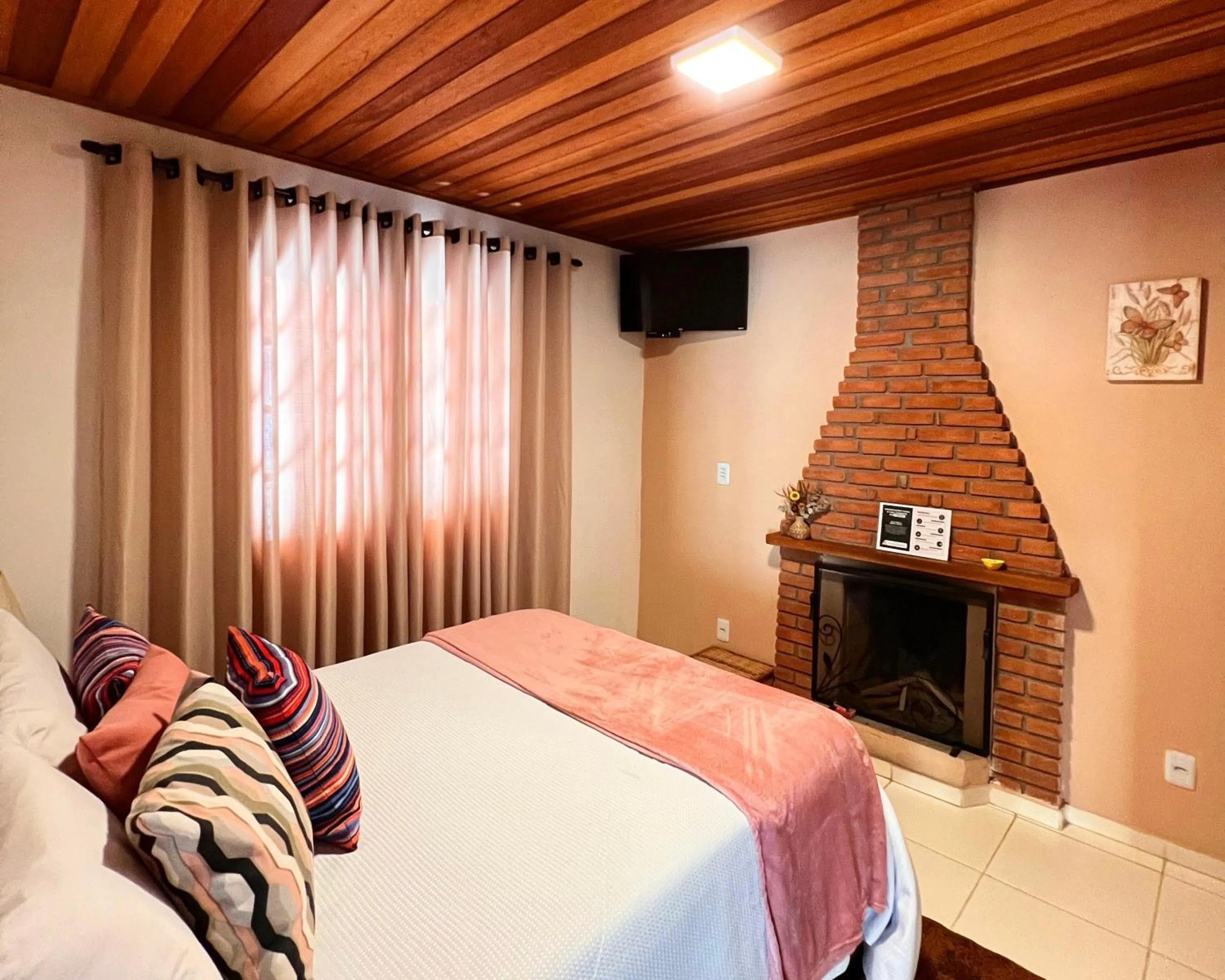 Bed in Chalés Recanto da cachoeira