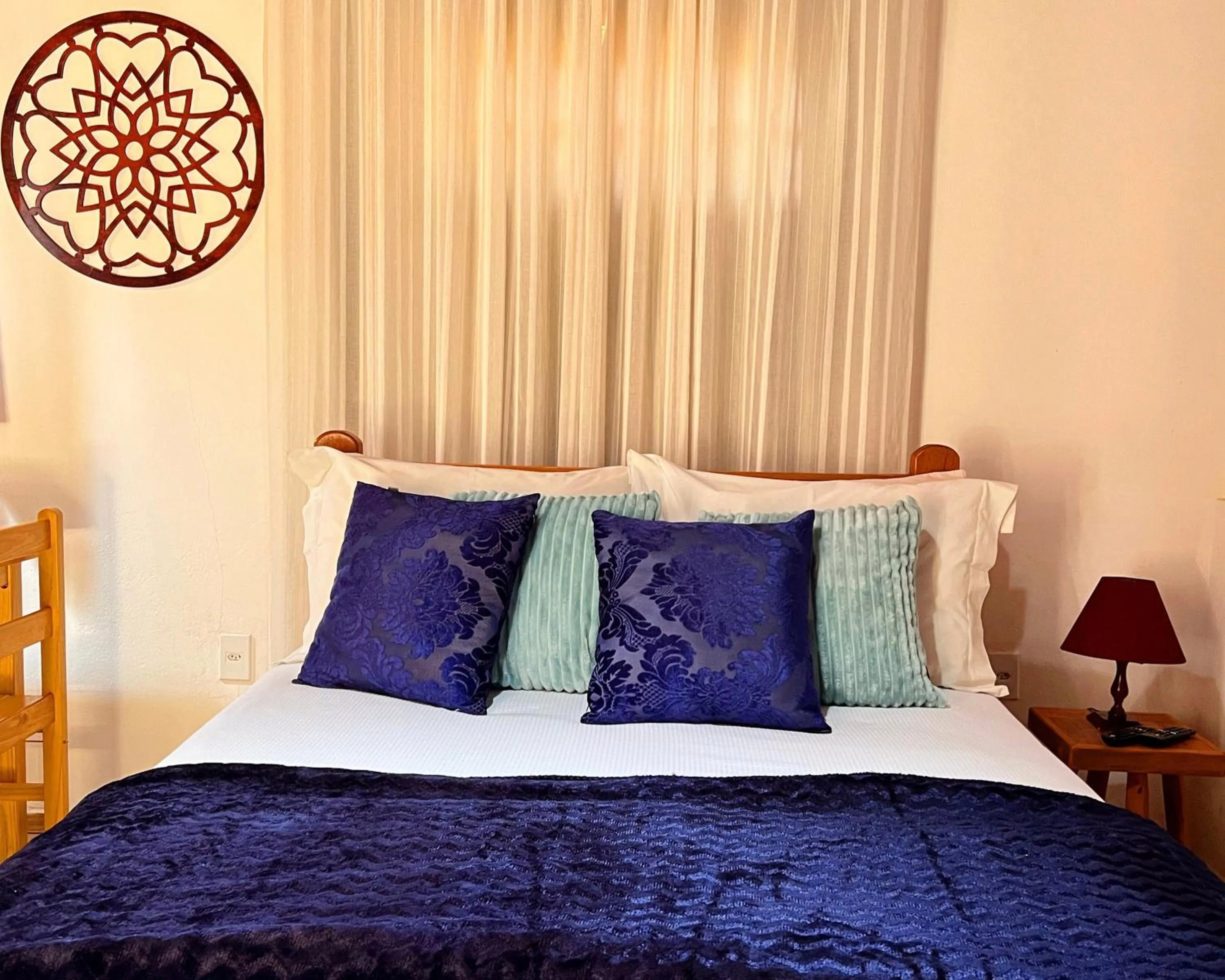 Bed in Chalés Recanto da cachoeira