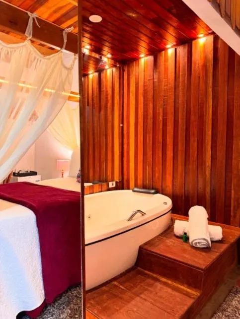 Bed in Chalés Recanto da cachoeira