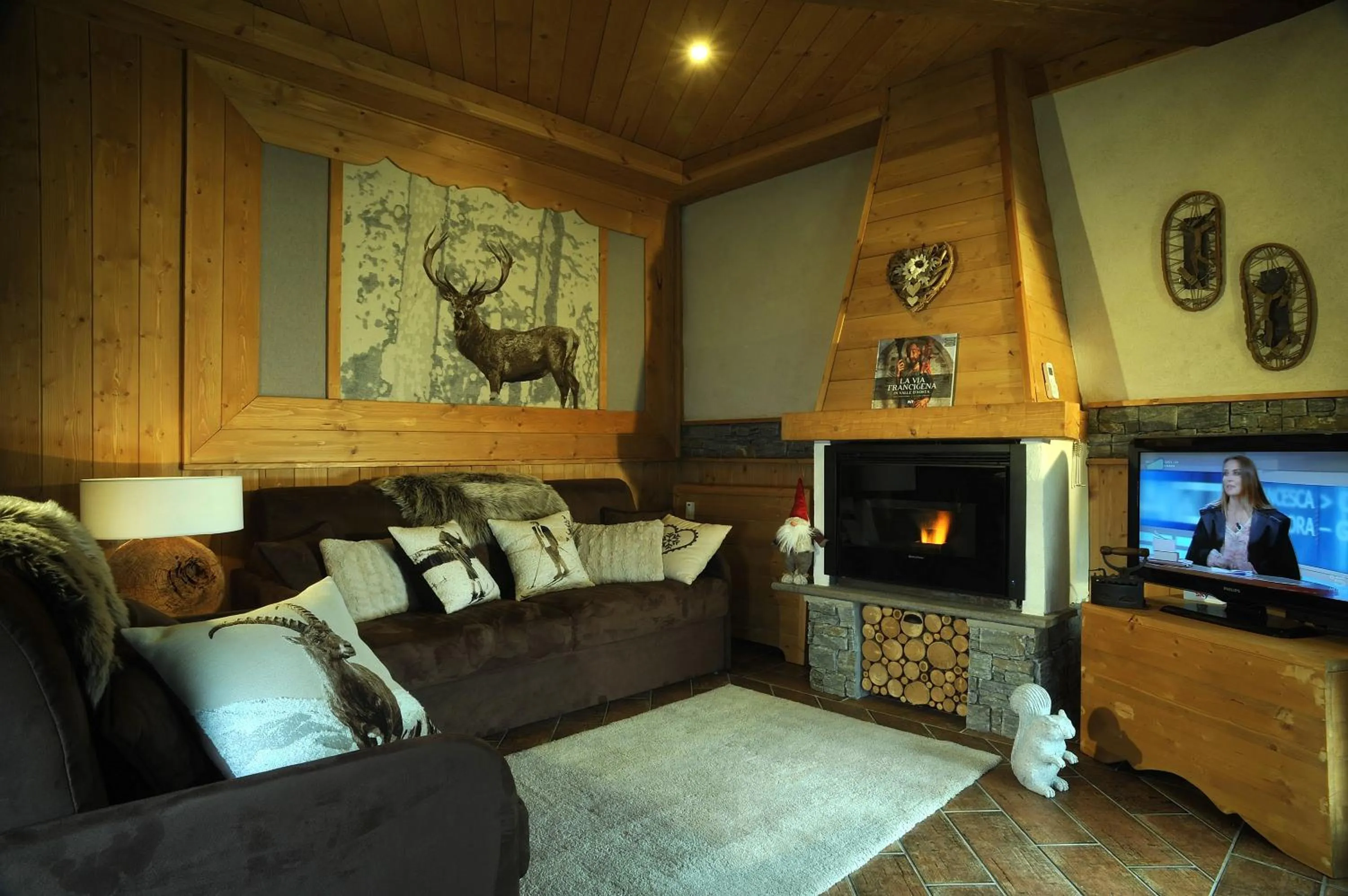 Living room in Aparthotel Foyer d'antan SUITE con caminetto hammam o vasca idromassaggio