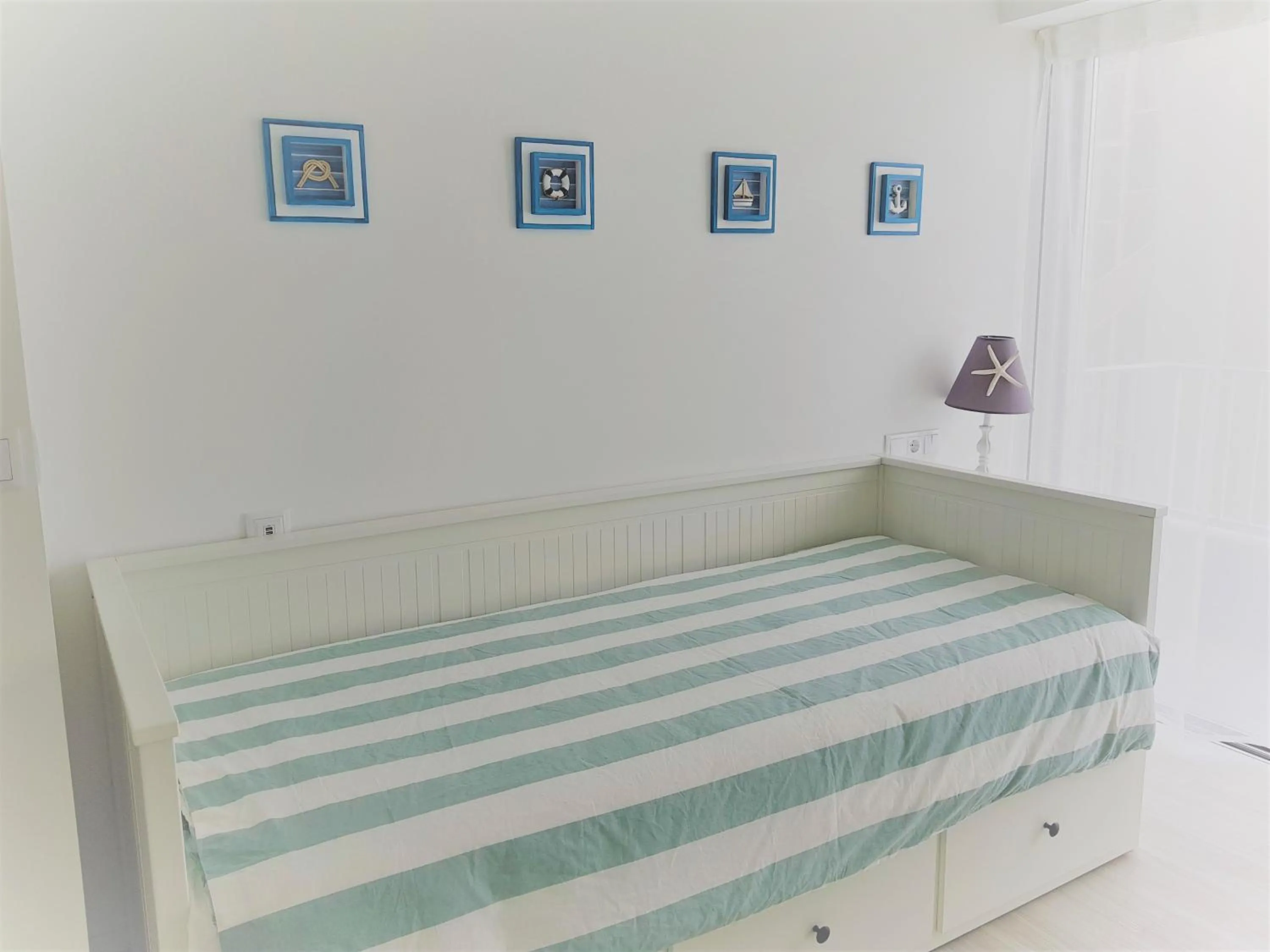 Bed in Blue Sea Apartment