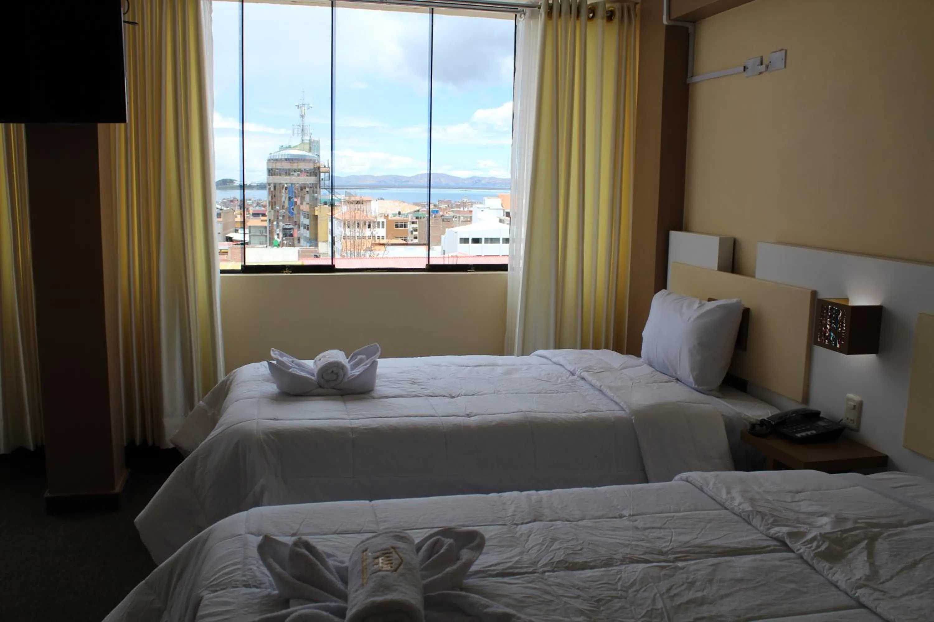 Bed in Kaaro Hotel Puno
