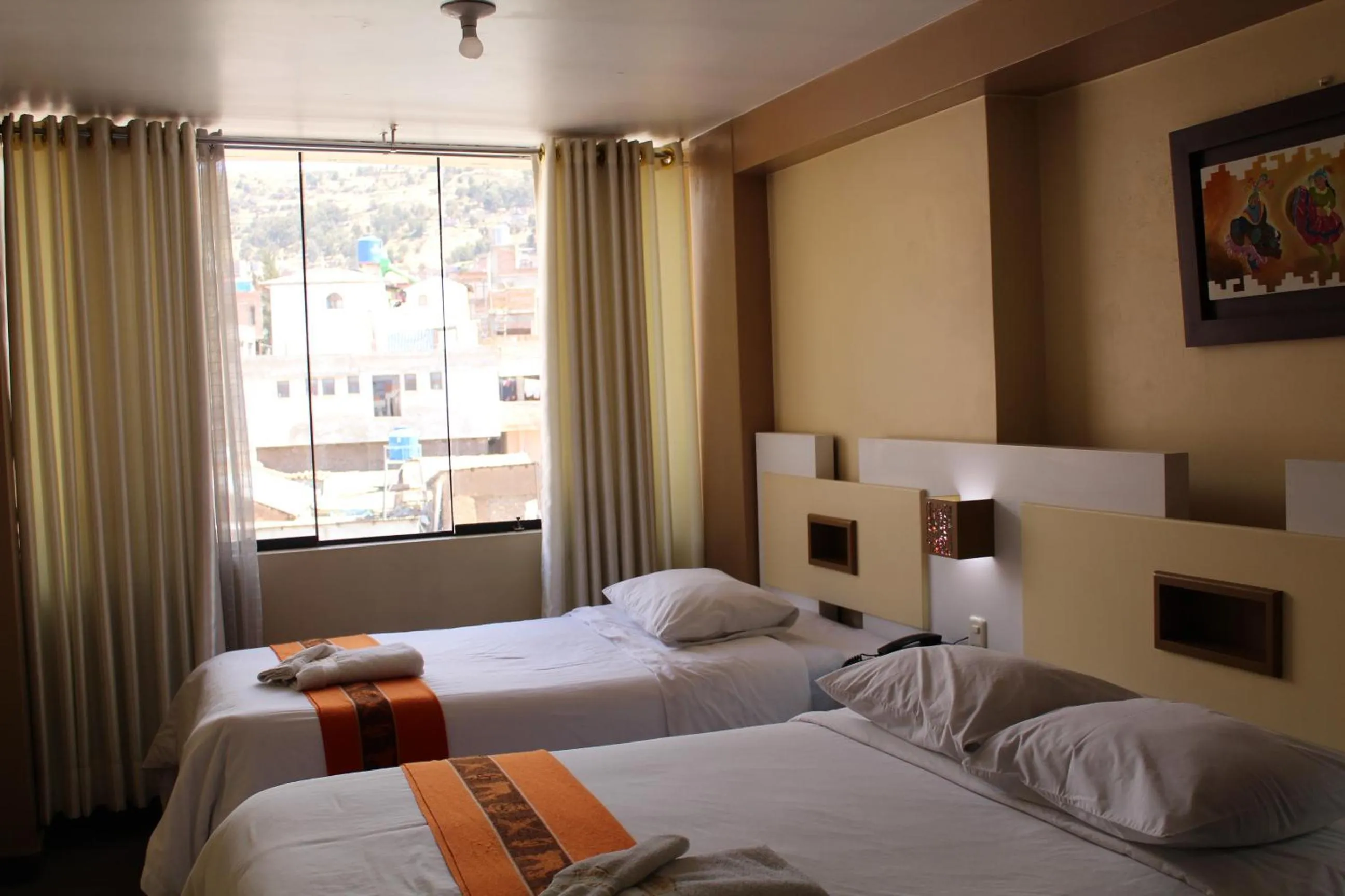 Bed in Kaaro Hotel Puno