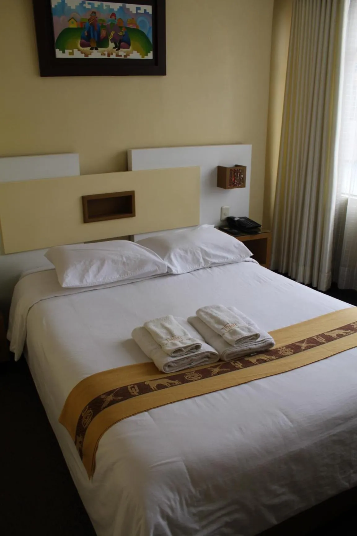 Bed in Kaaro Hotel Puno