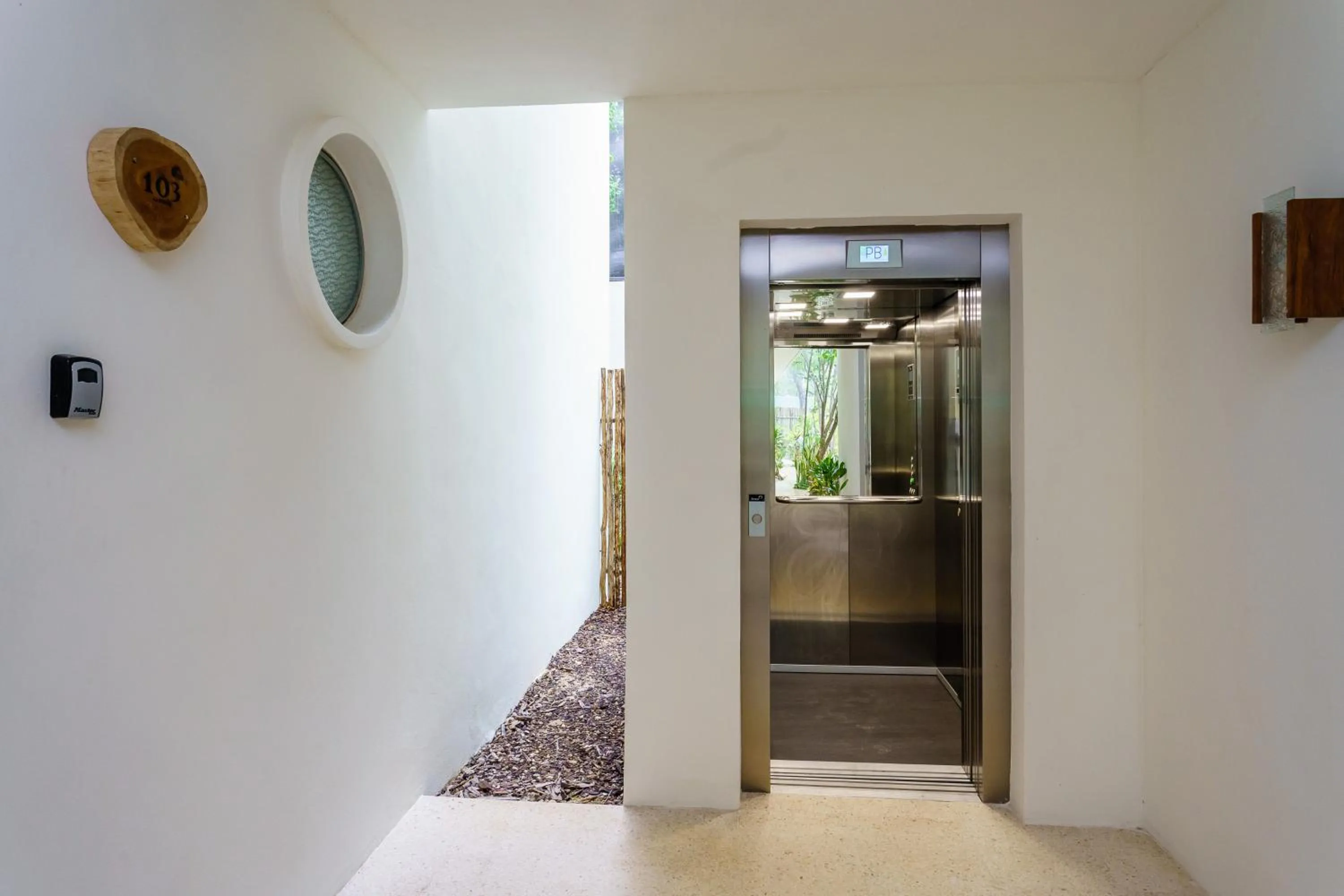 Property building in Charming Nature-Inspired Condos with Sultry Surroundings by Stella Rentals