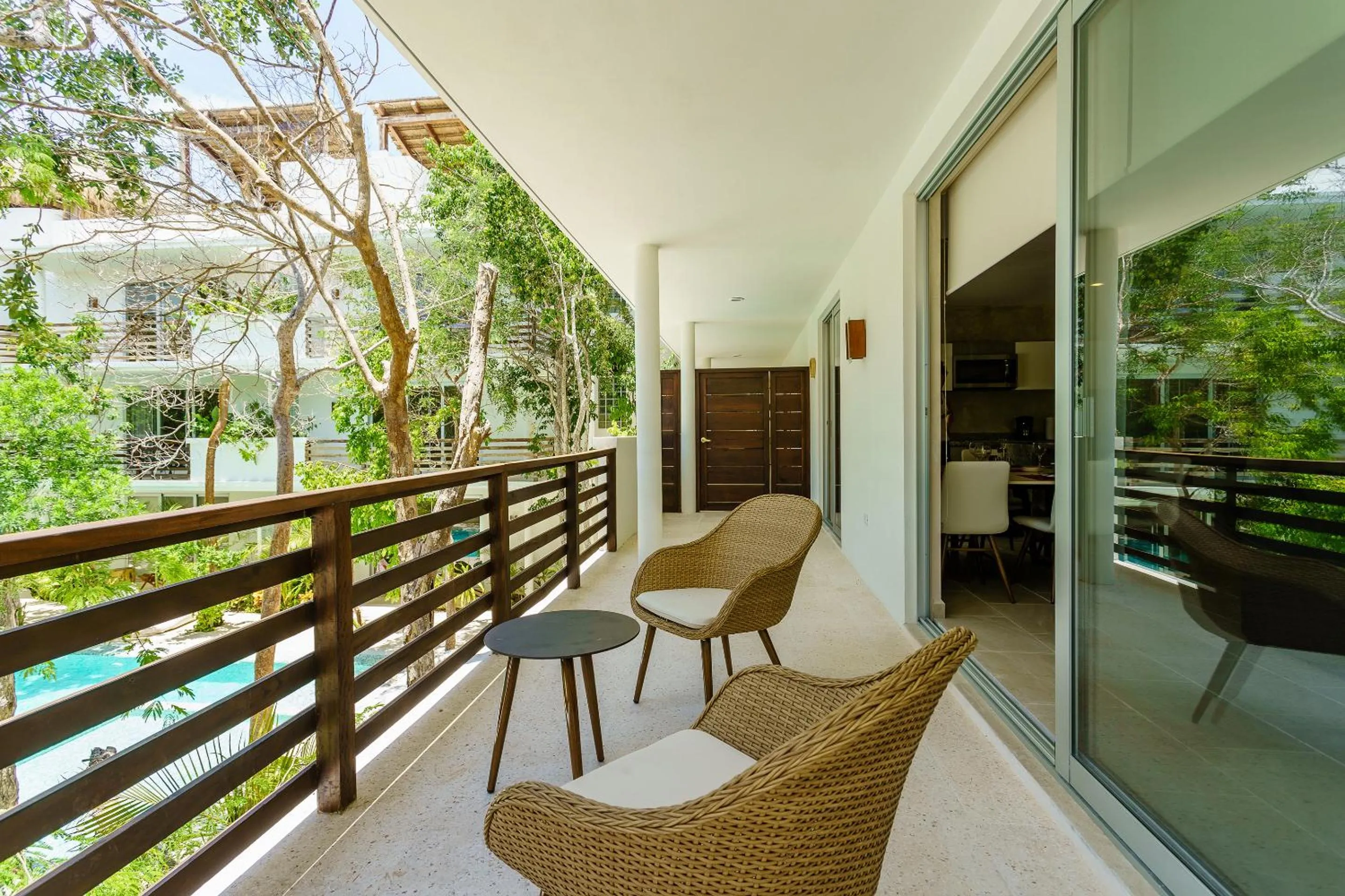 Balcony/Terrace in Charming Nature-Inspired Condos with Sultry Surroundings by Stella Rentals