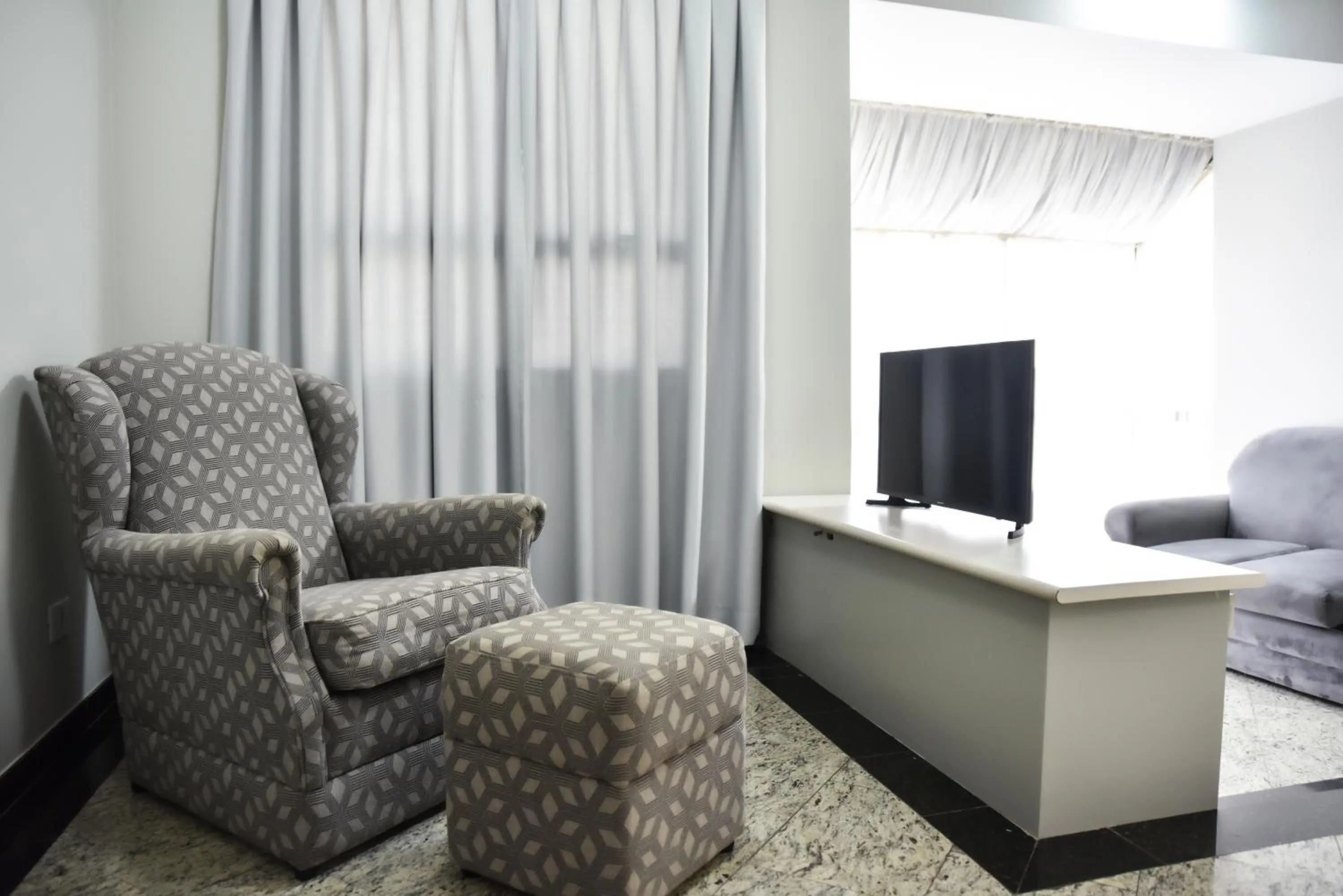 Communal lounge/ TV room in Plaza Inn Small Town Flat