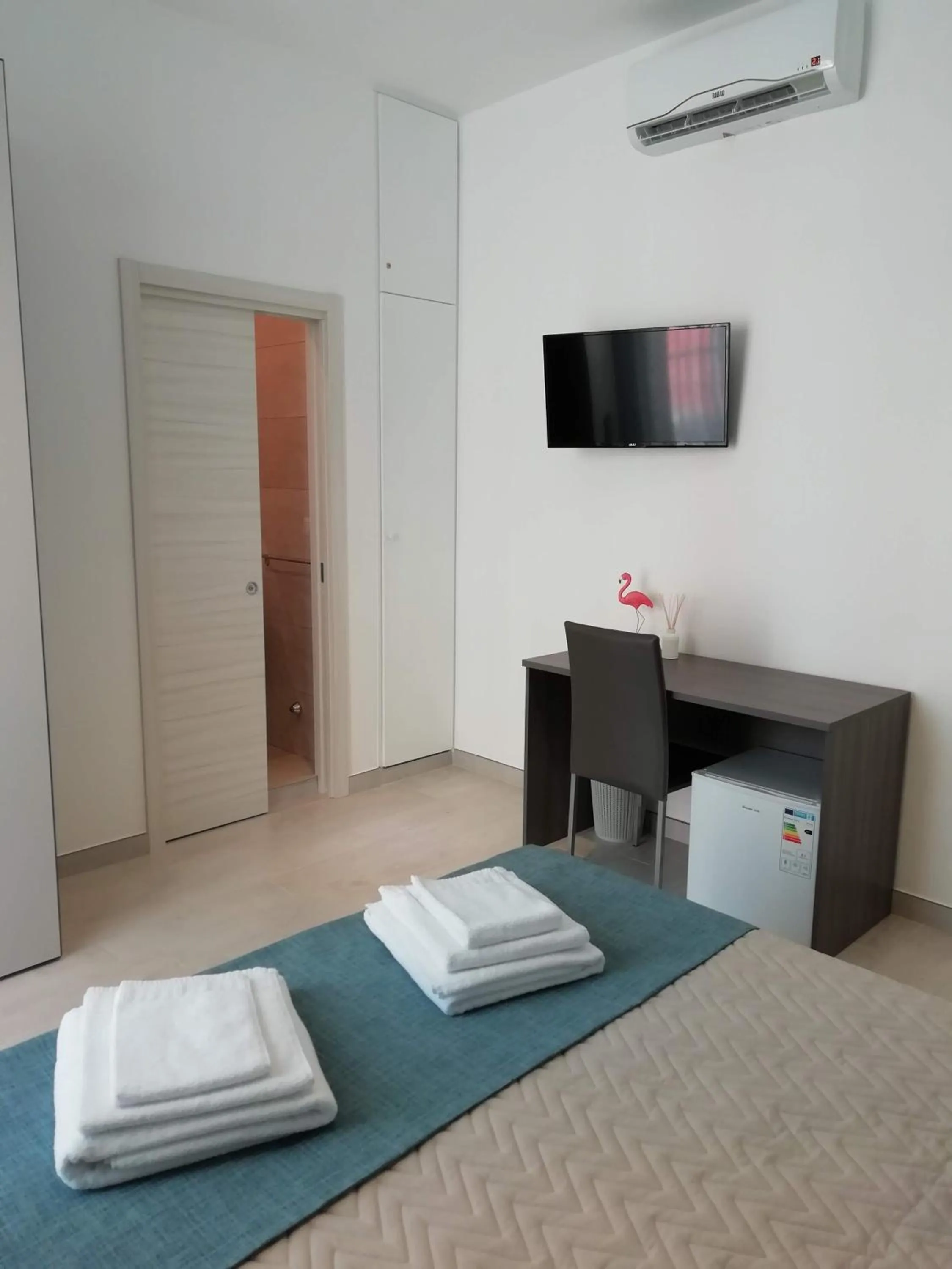 Bed in Flamingo Rooms