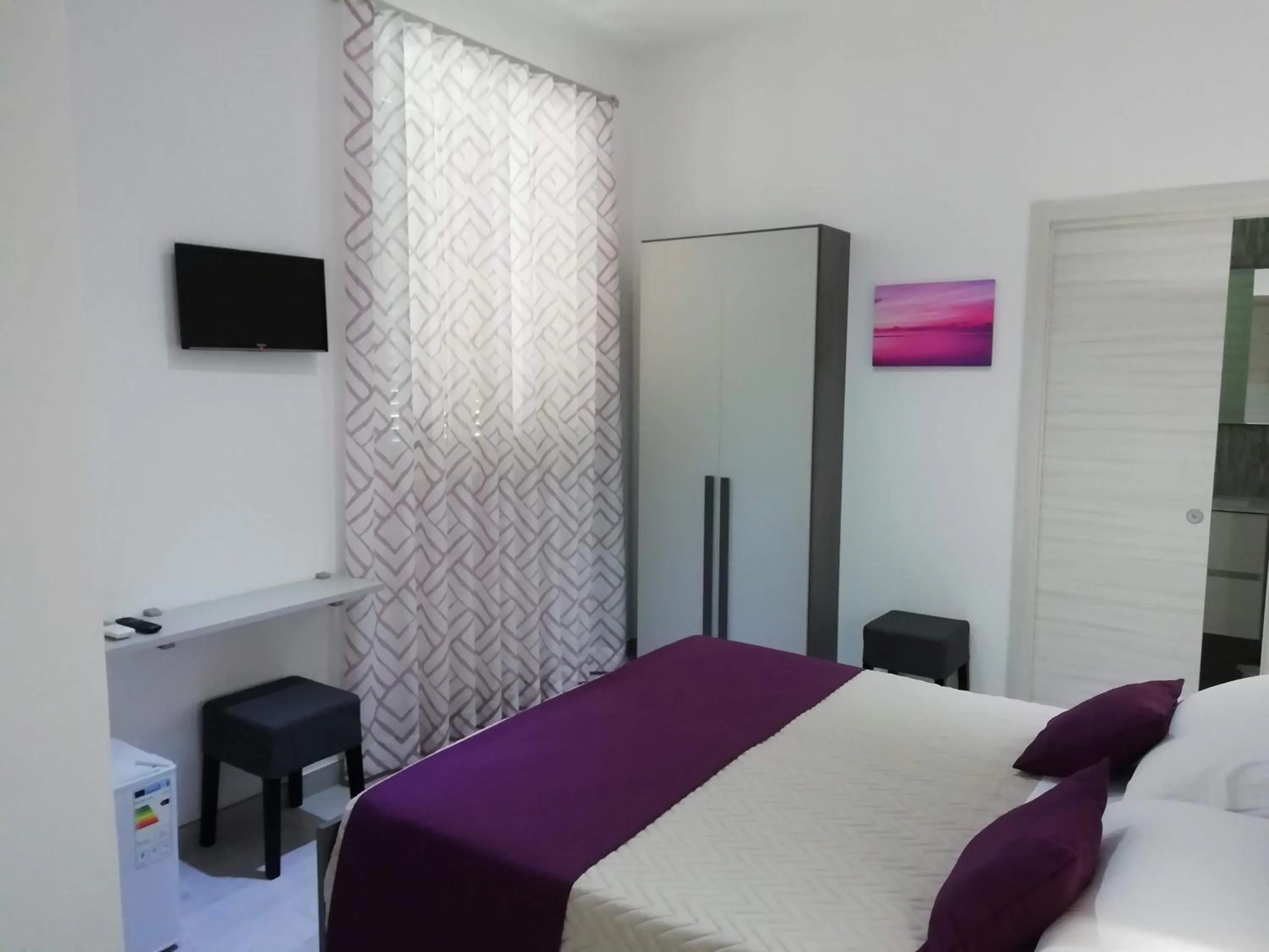 Bed in Flamingo Rooms