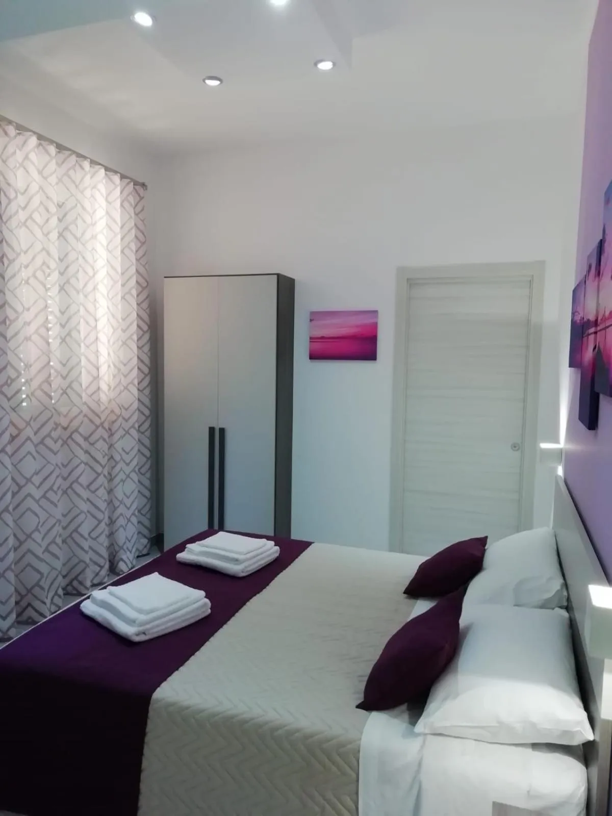 Bed in Flamingo Rooms