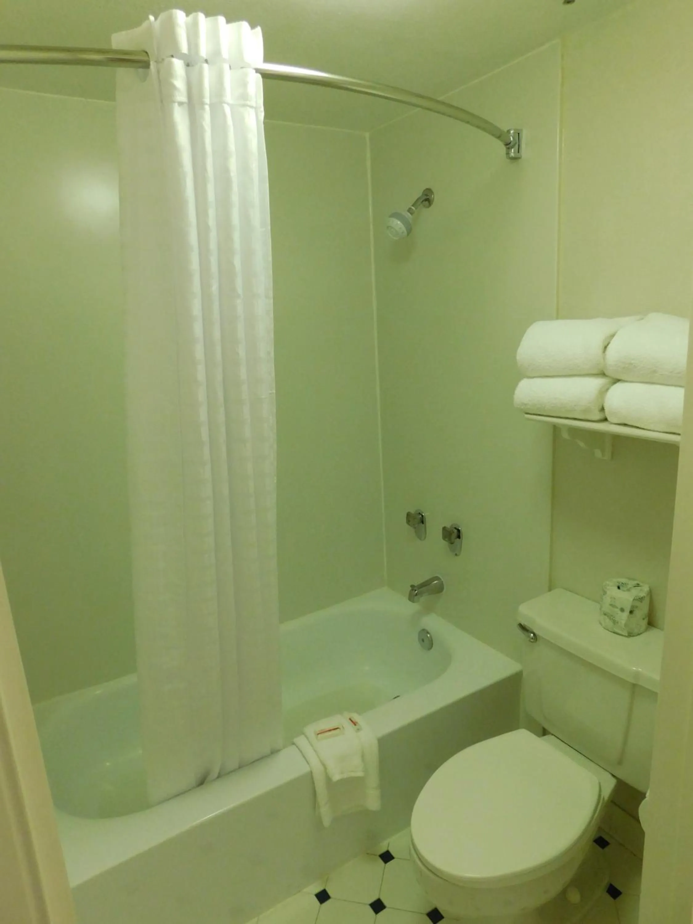 Bathroom in Days Inn & Suites by Wyndham Arlington Heights