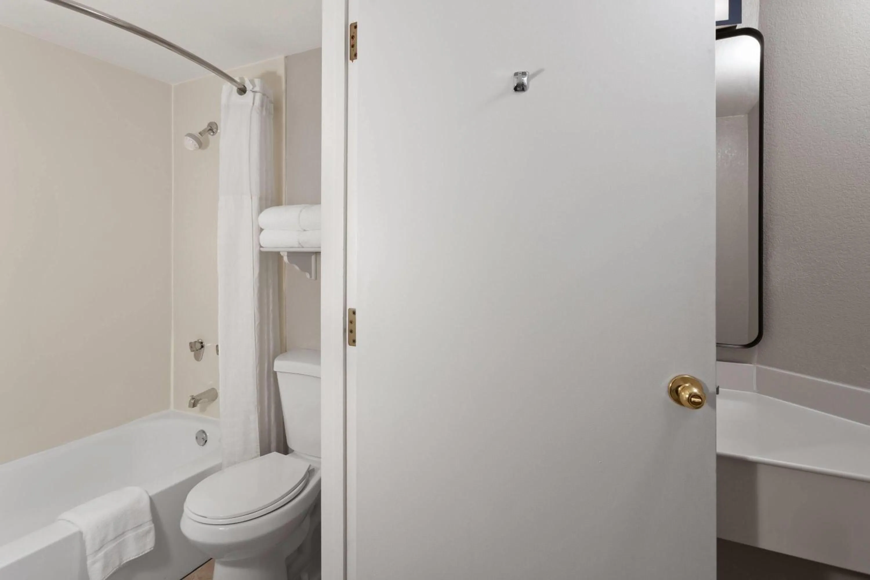 Bathroom in Days Inn & Suites by Wyndham Arlington Heights