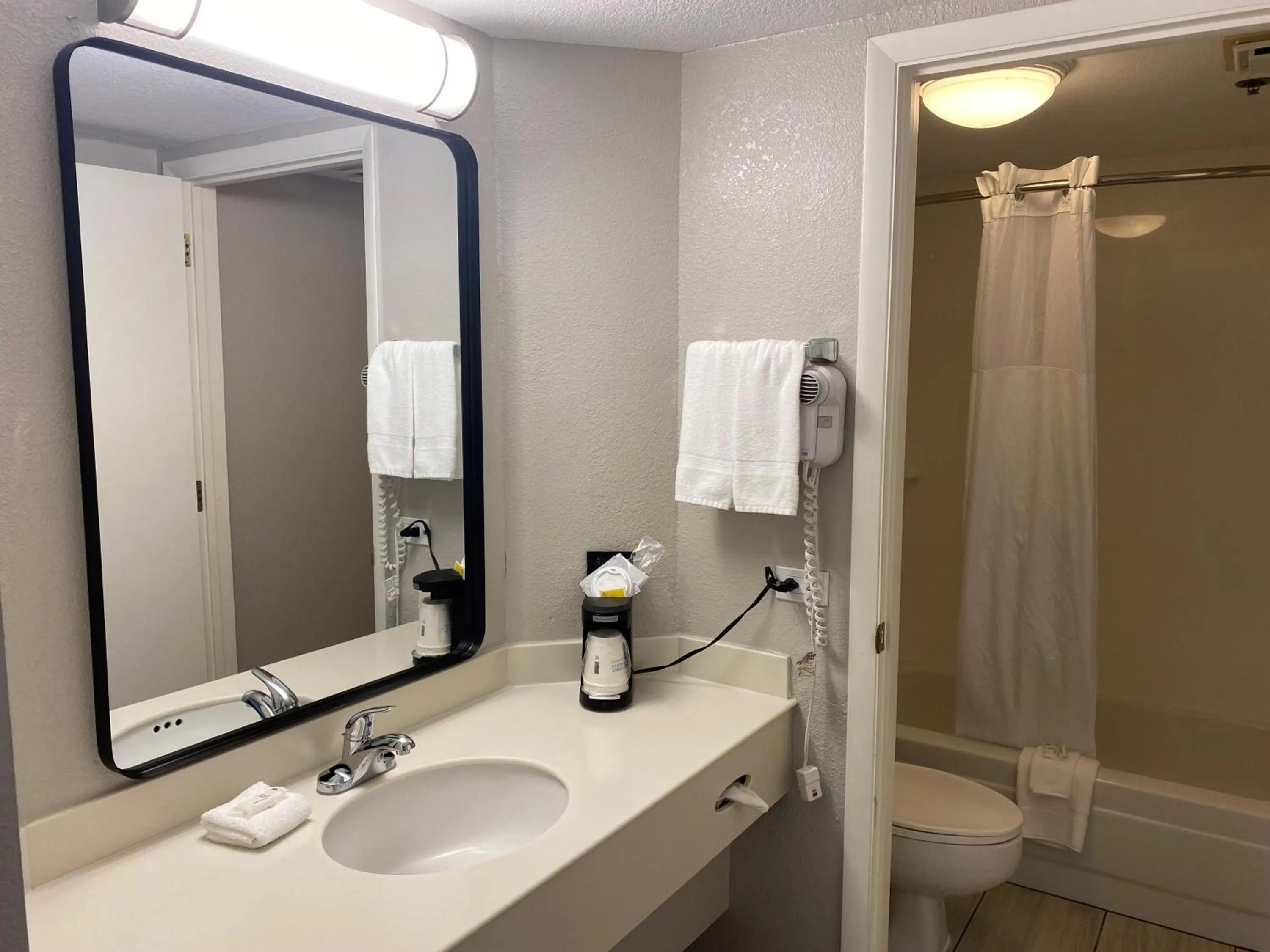 Bathroom in Days Inn & Suites by Wyndham Arlington Heights