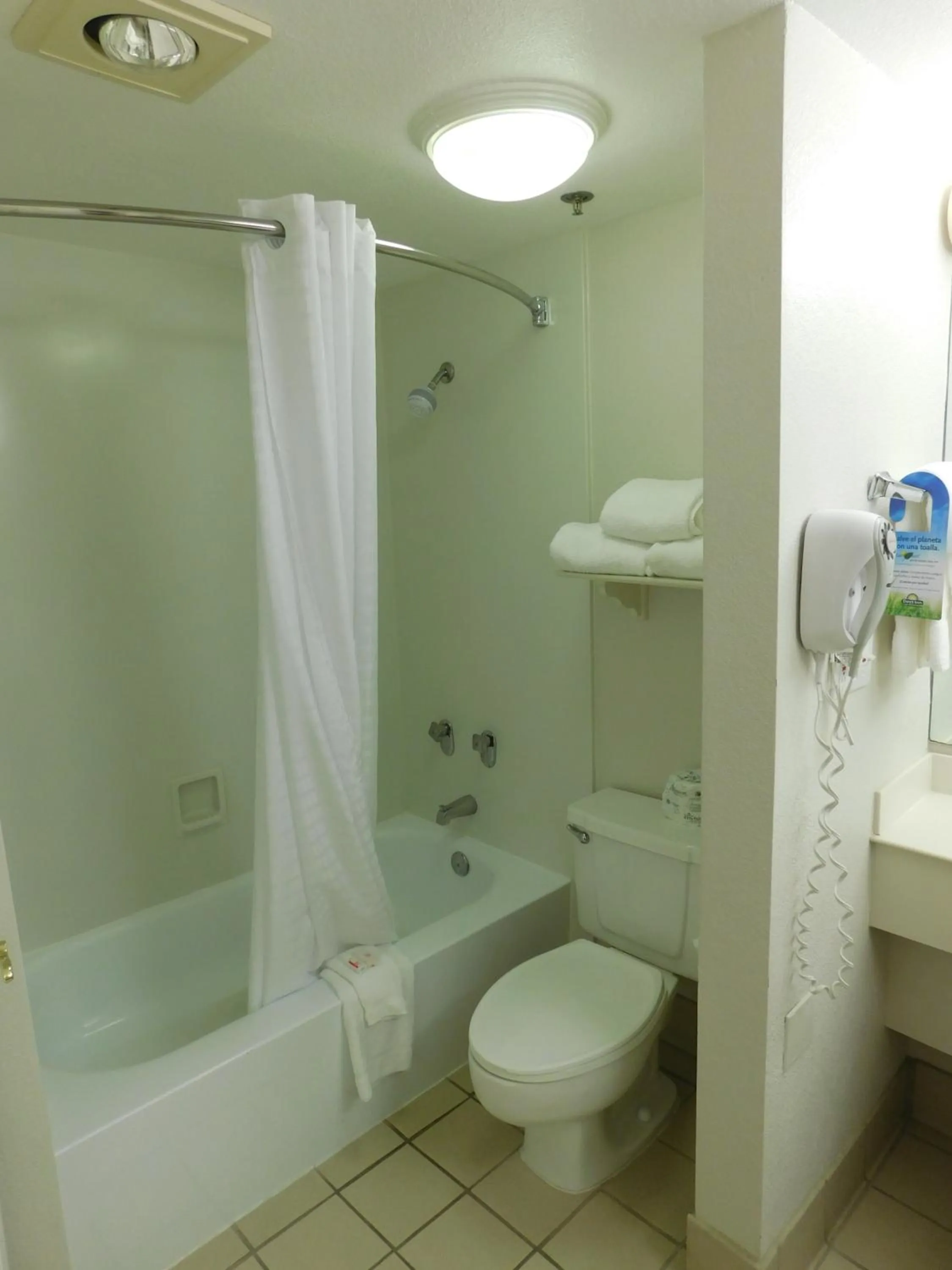 Bathroom in Days Inn & Suites by Wyndham Arlington Heights