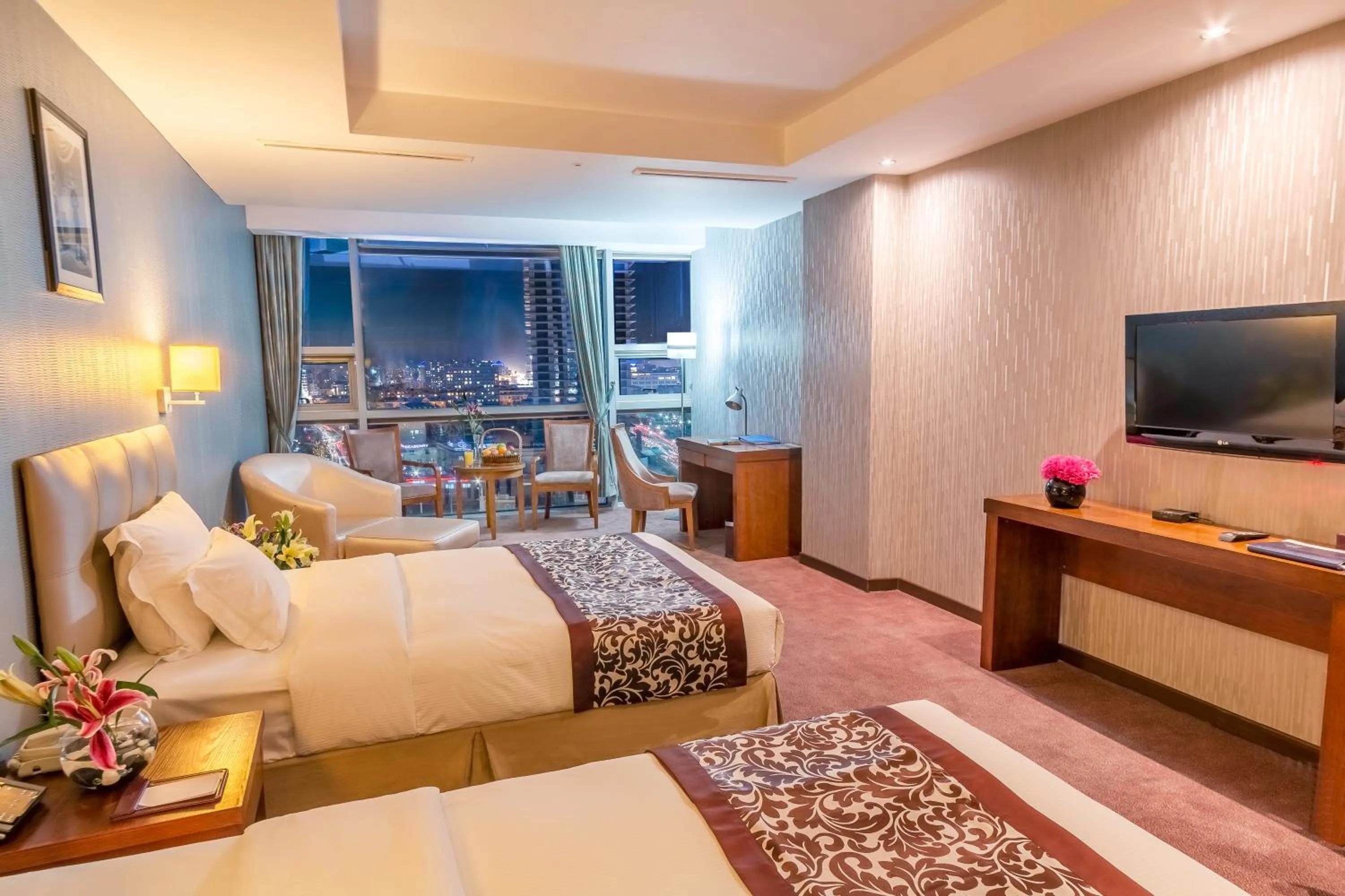 Bed in The Blue Sky Hotel and Tower