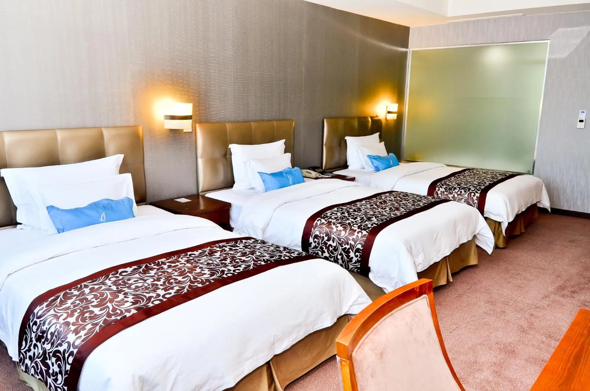 Bed in The Blue Sky Hotel and Tower