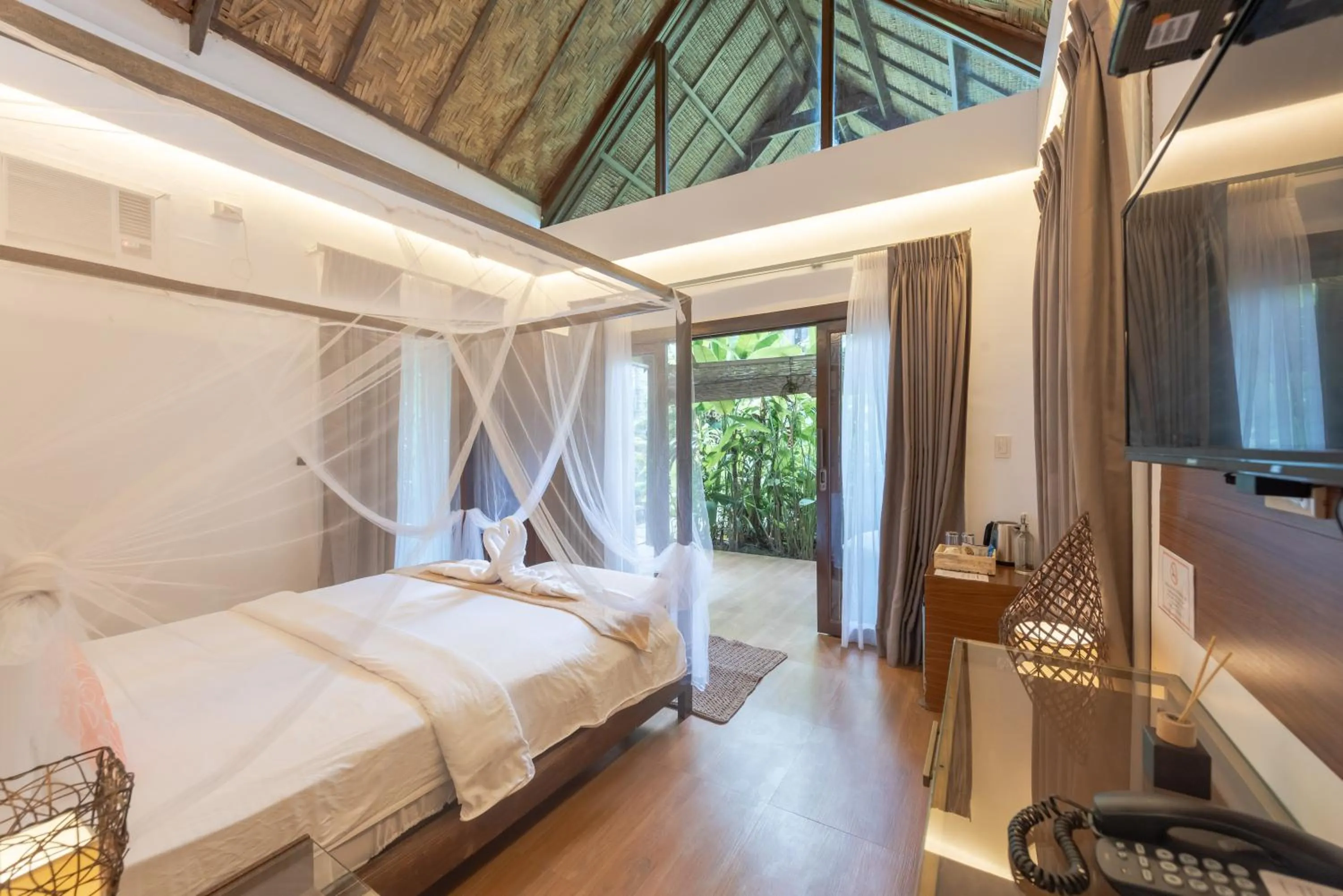 Photo of the whole room, Bed in The Hillside Resort Siargao