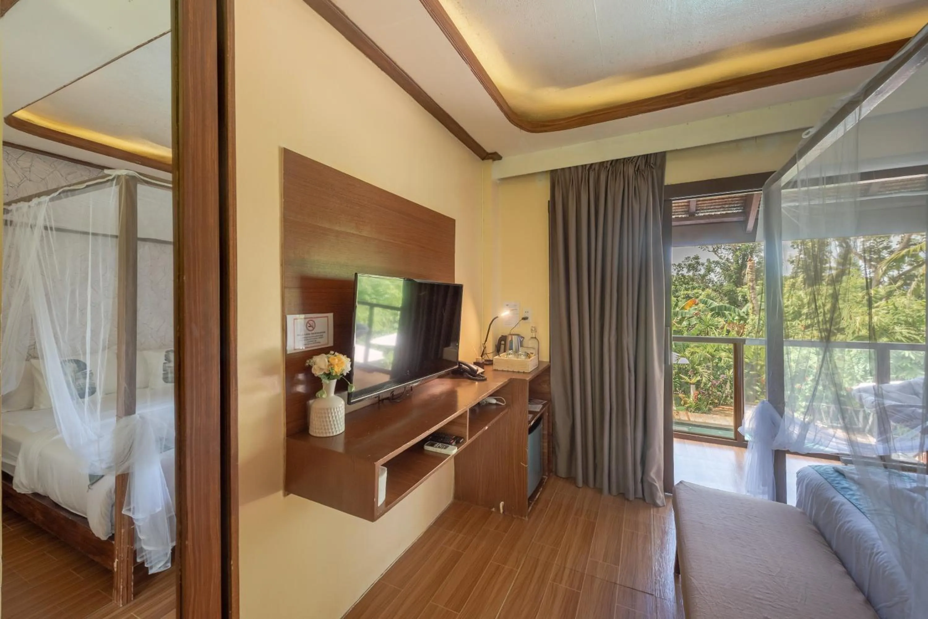 Photo of the whole room, Bed in The Hillside Resort Siargao