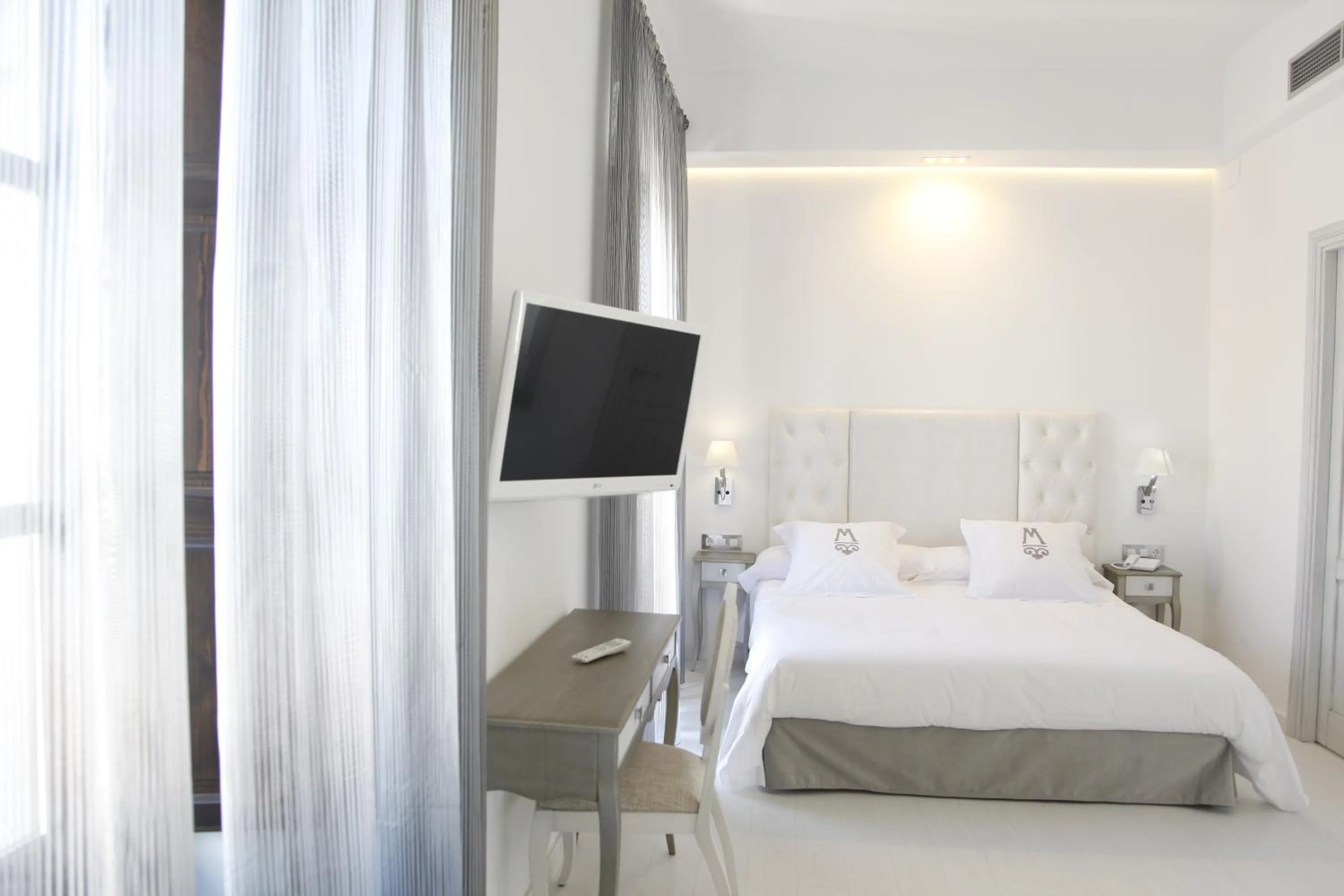 Bed in La Casa del Médico Hotel Boutique