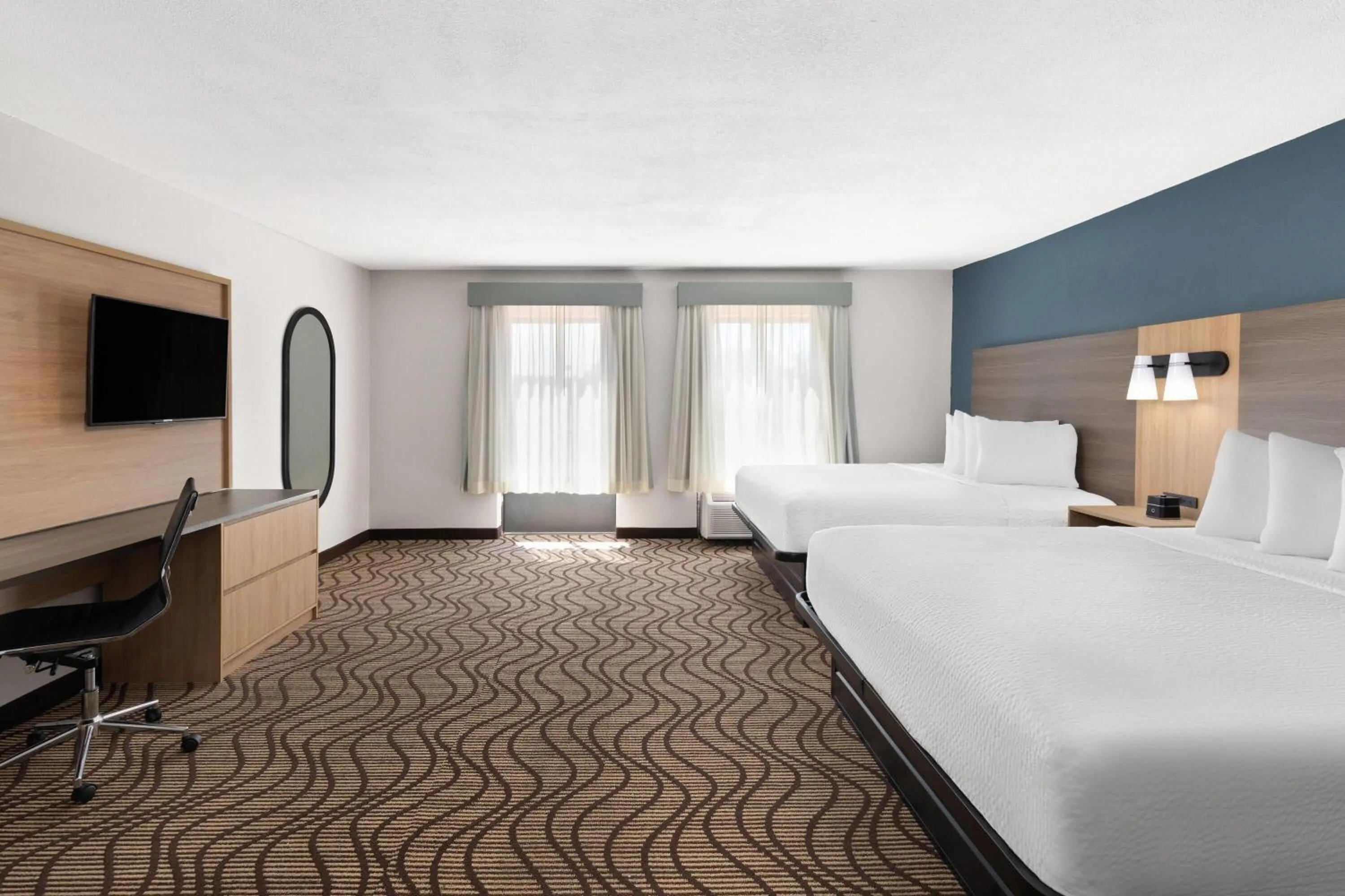 Photo of the whole room, Bed in Baymont by Wyndham Moss Point Pascagoula