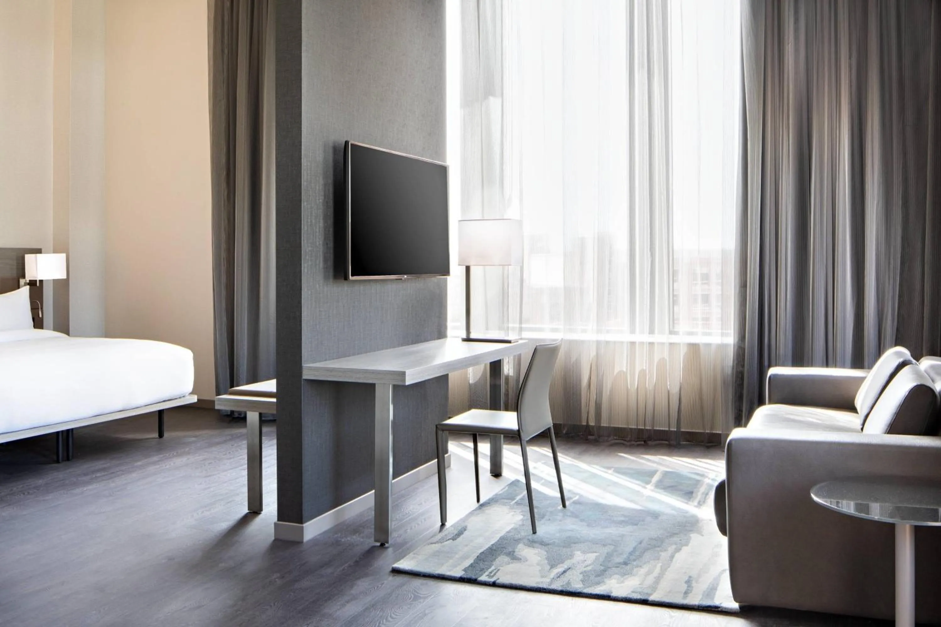 Living room, Bed in AC Hotel by Marriott Grand Rapids Downtown