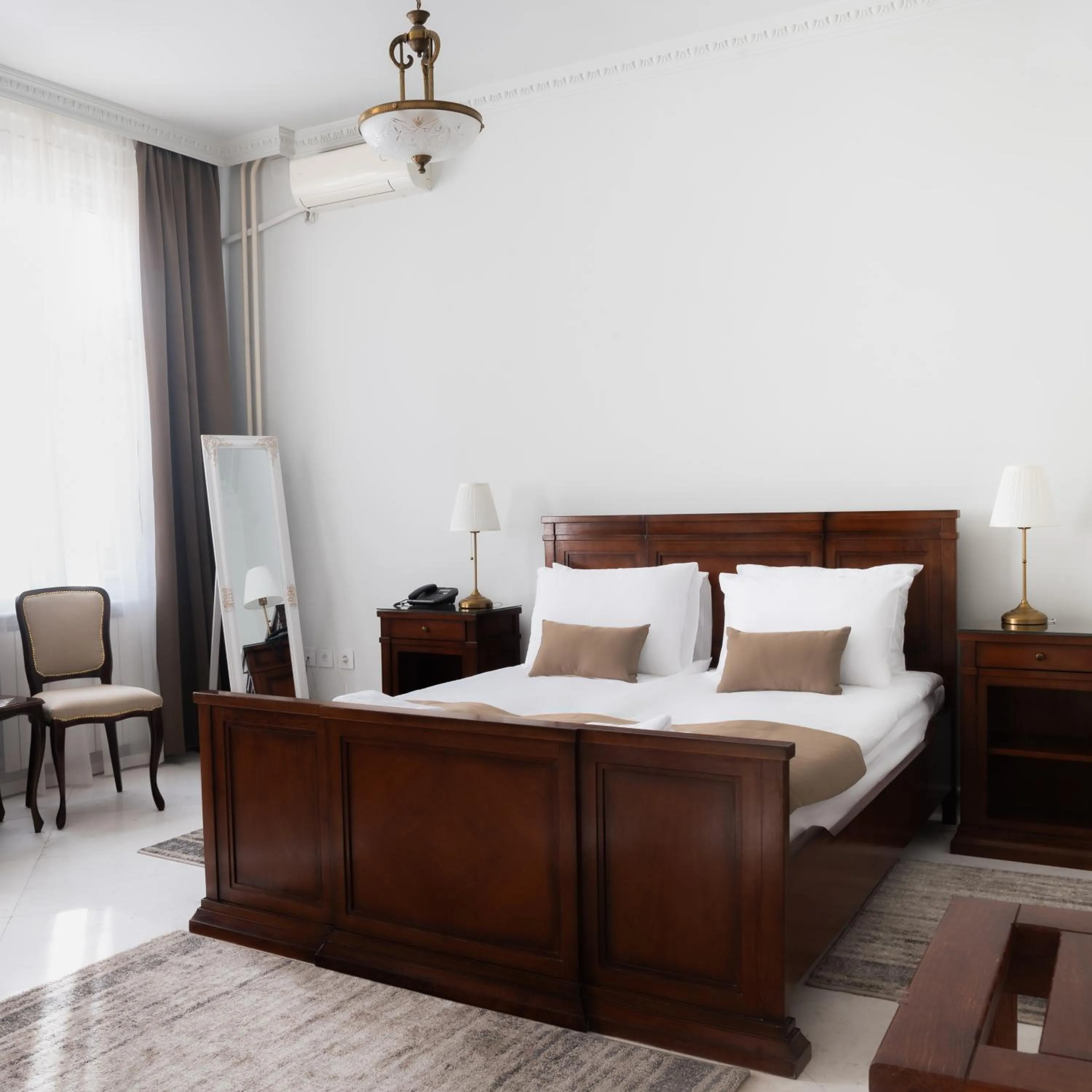 Bed in Garni Hotel Helvetia