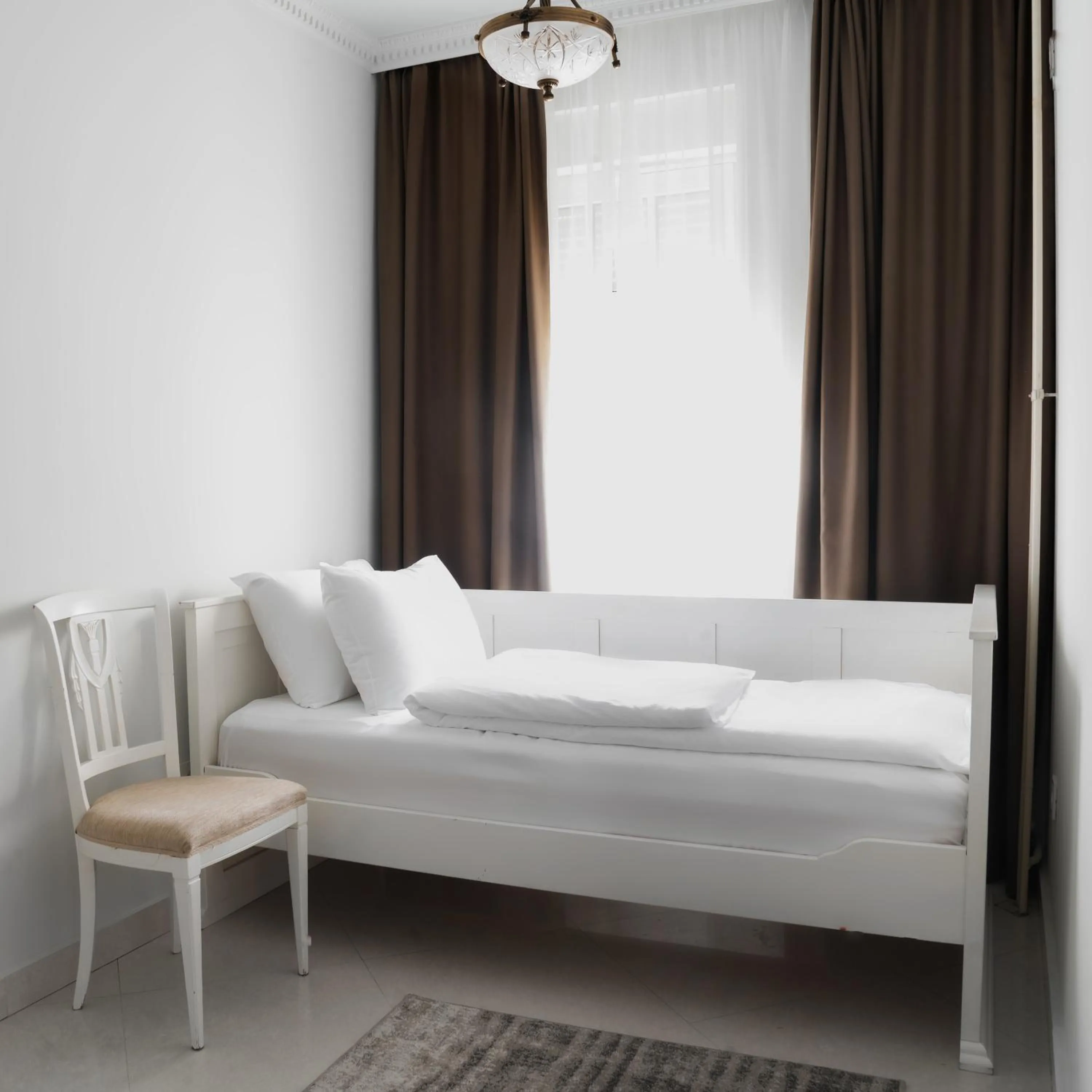 Bed in Garni Hotel Helvetia