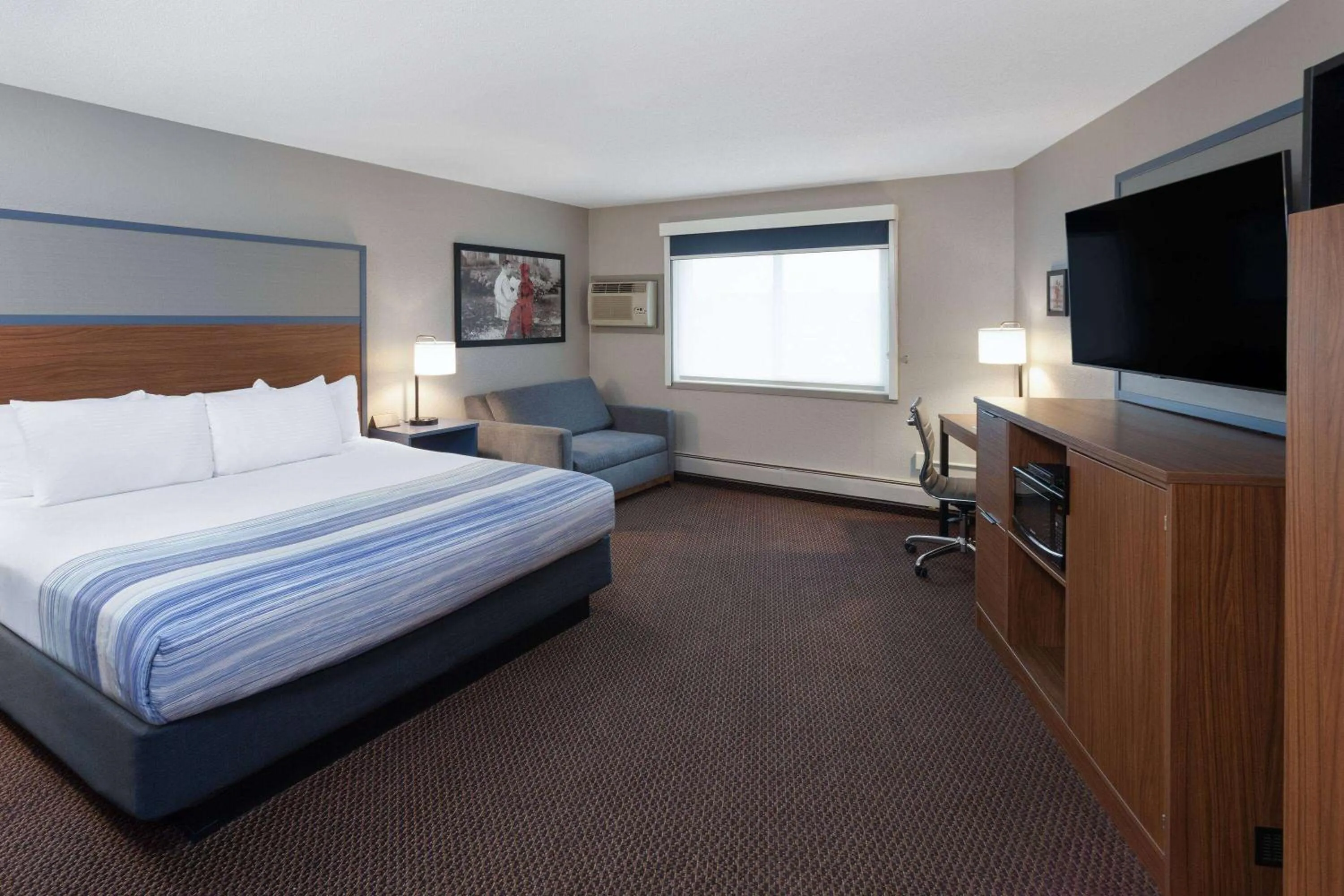 Photo of the whole room, Bed in AmericInn by Wyndham New Richmond