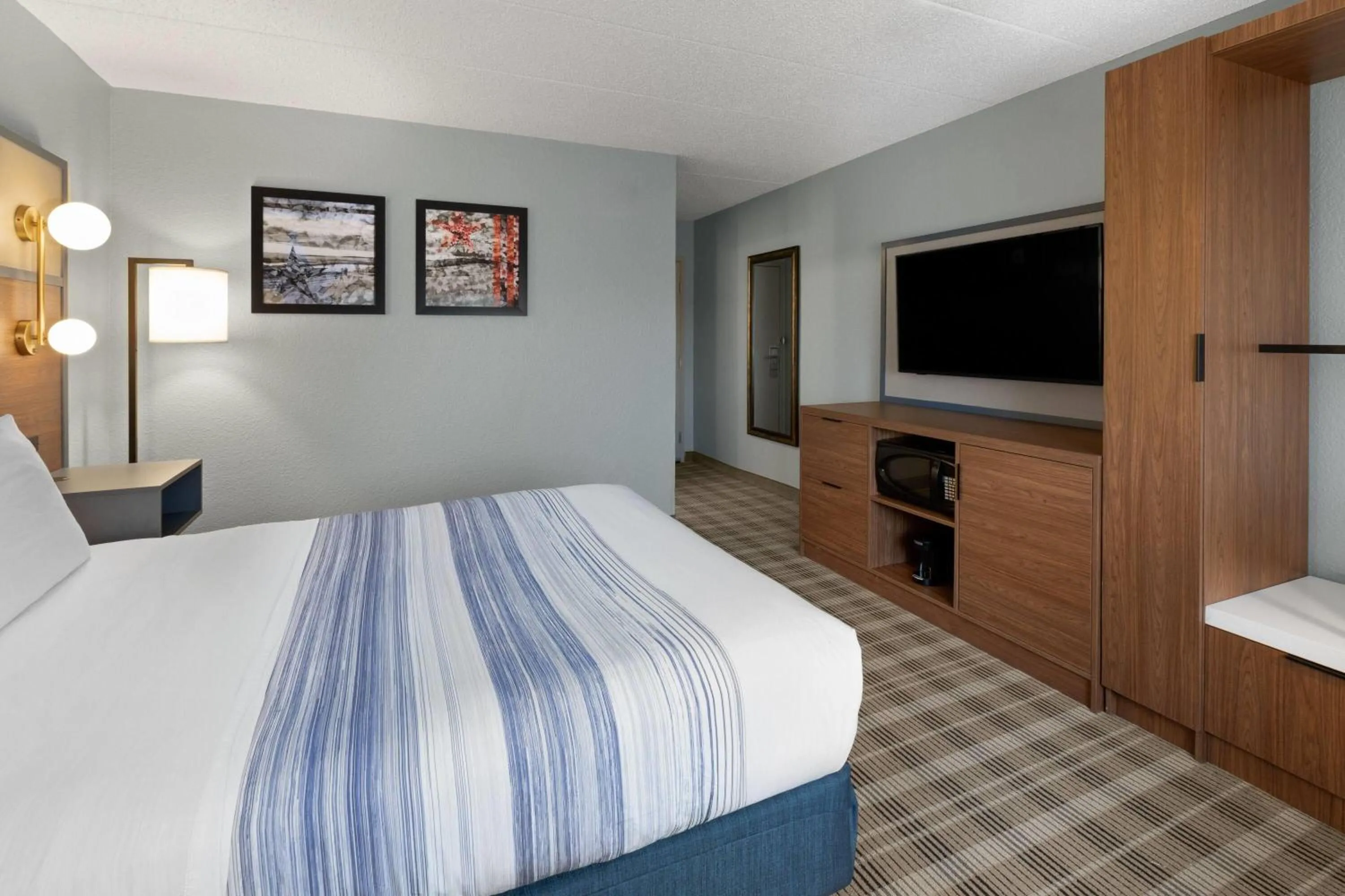 Photo of the whole room, Bed in AmericInn by Wyndham Chippewa Falls
