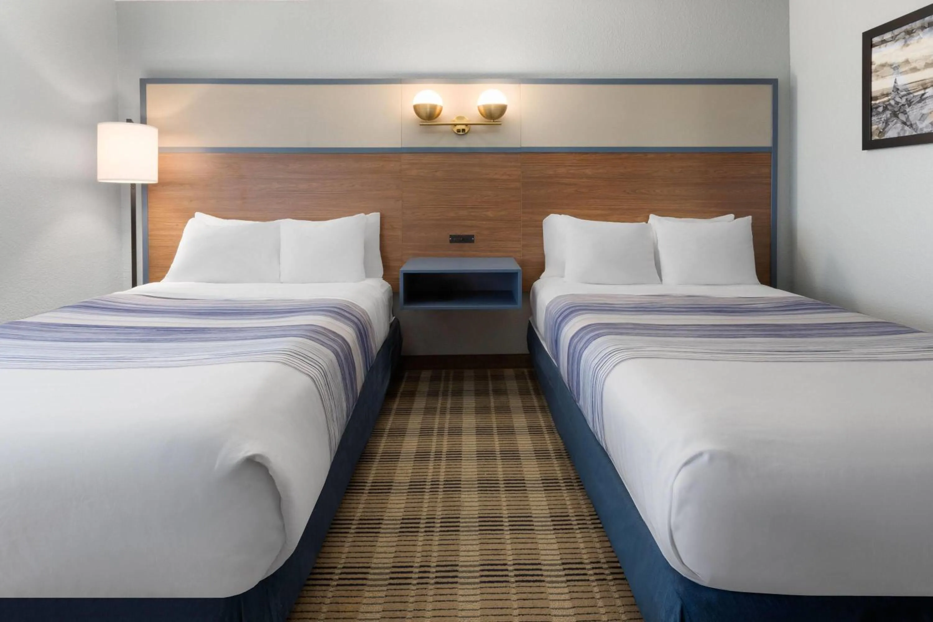 Photo of the whole room, Bed in AmericInn by Wyndham Chippewa Falls