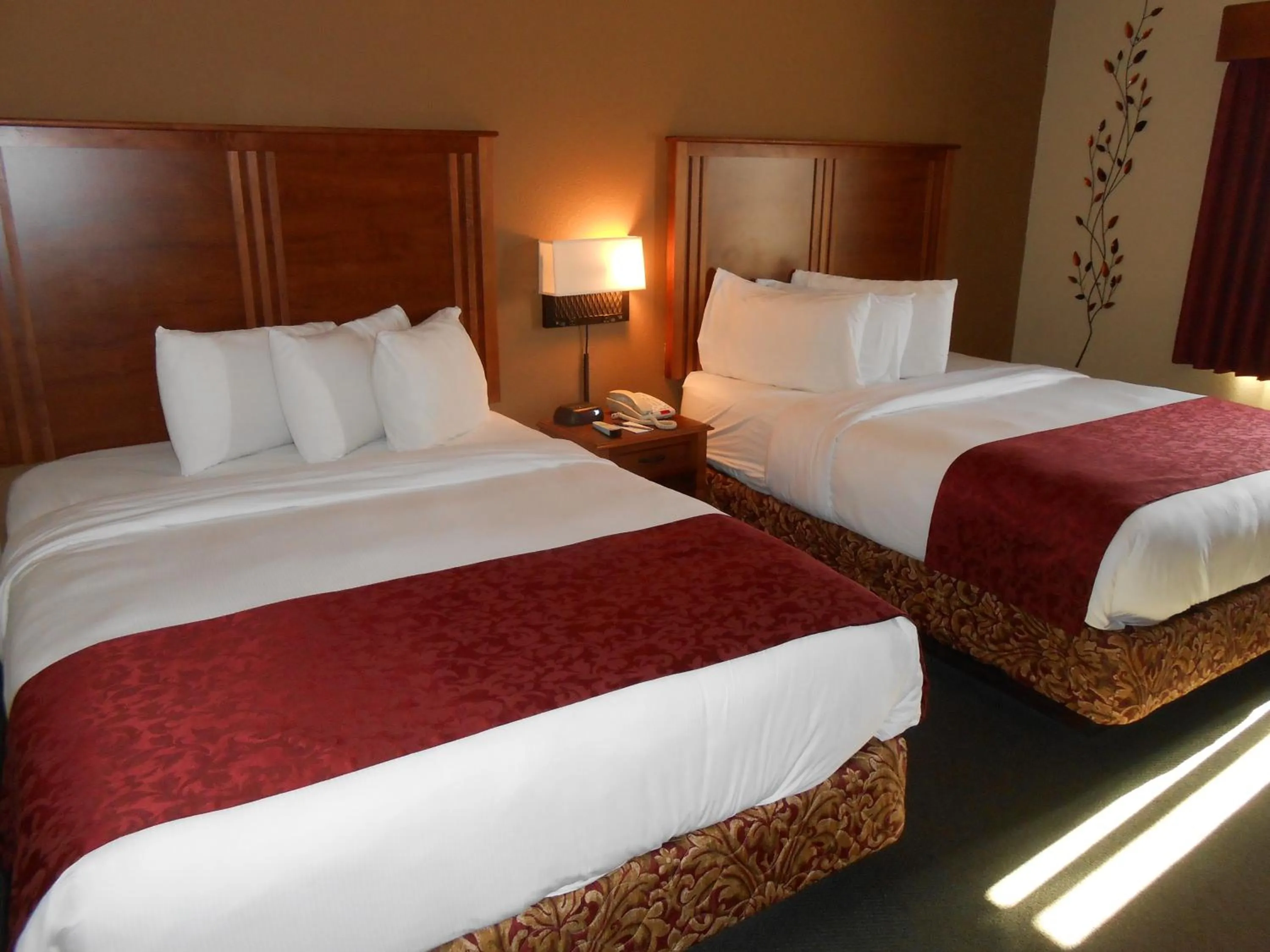 Bed in AmericInn by Wyndham McAlester