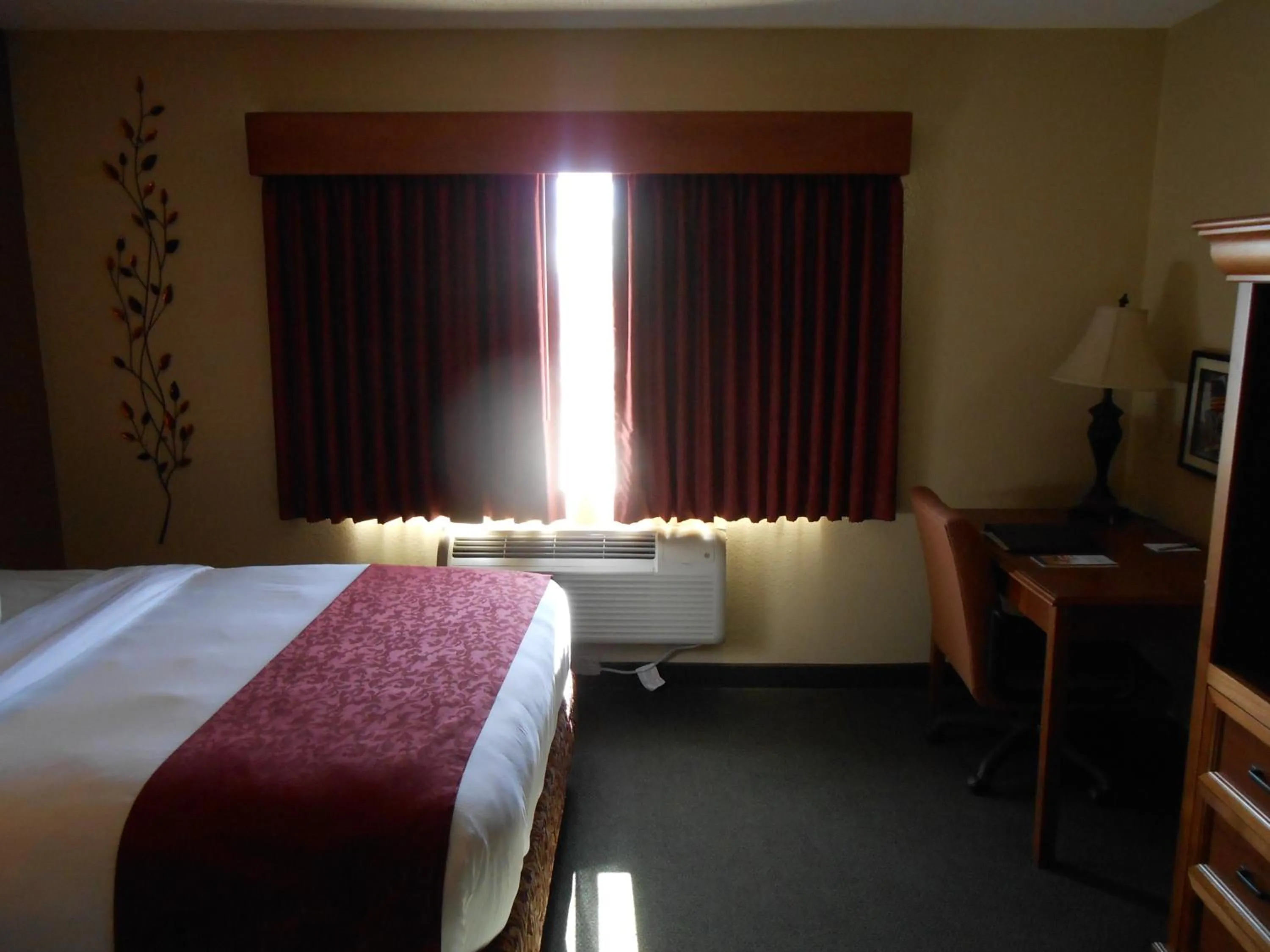 Bed in AmericInn by Wyndham McAlester