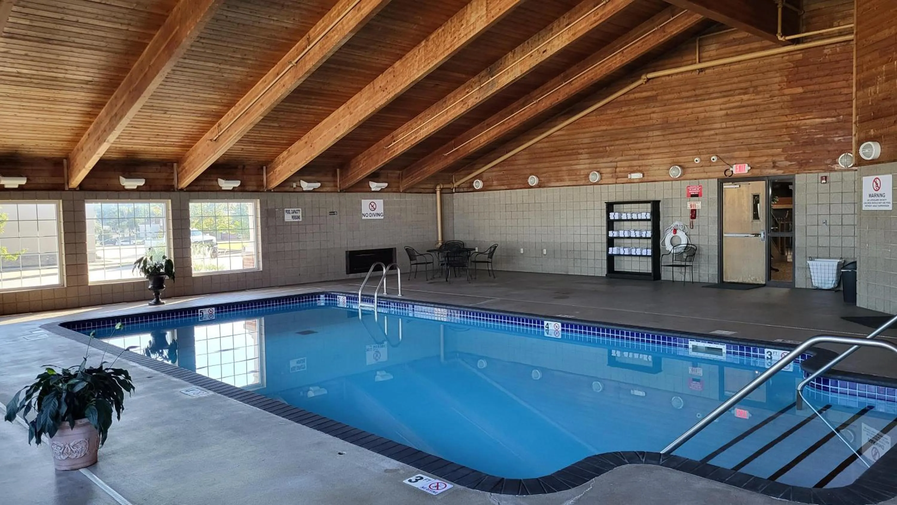 Swimming pool in AmericInn by Wyndham McAlester