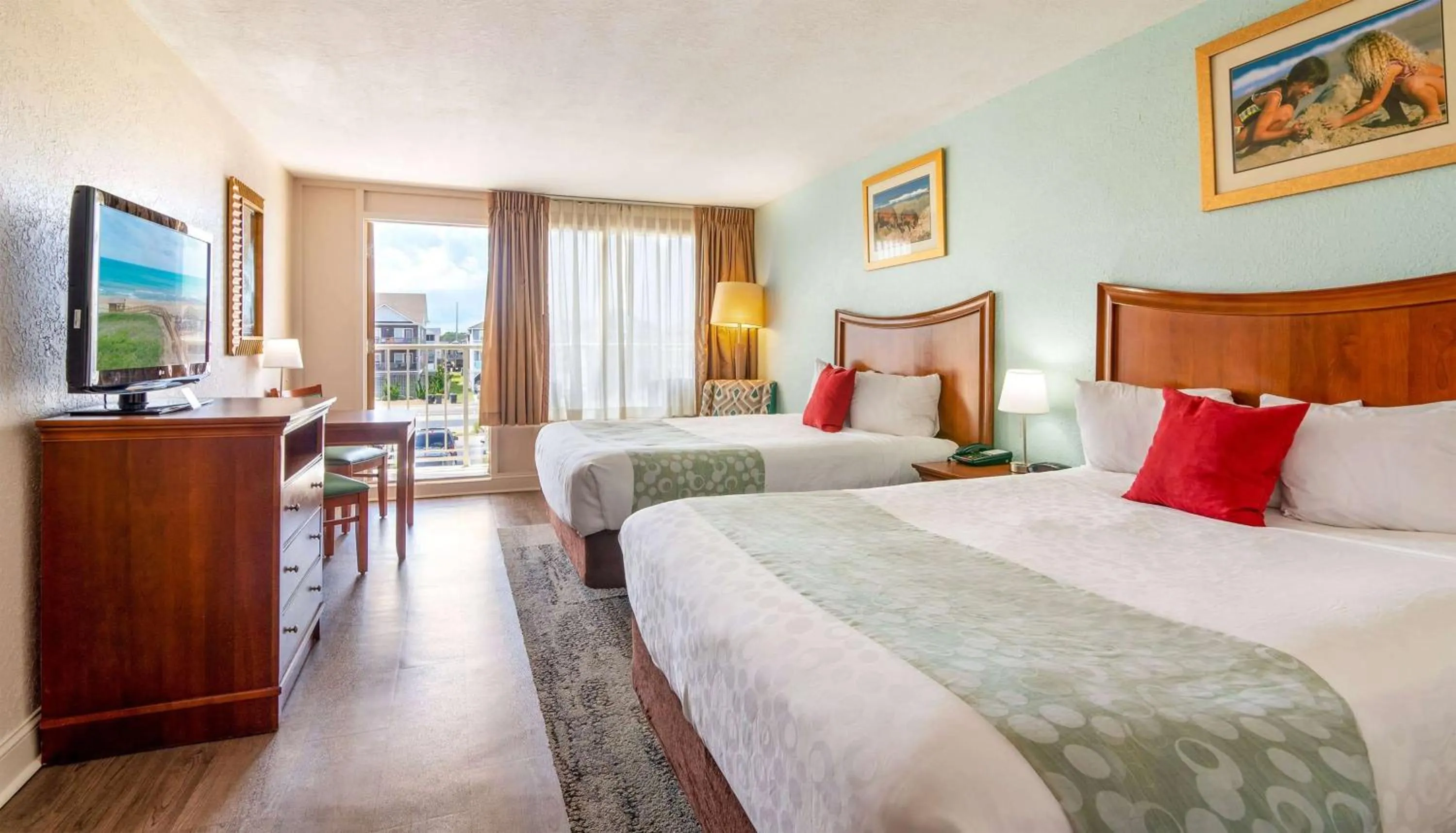 Photo of the whole room, Bed in Ramada Plaza by Wyndham Nags Head Oceanfront