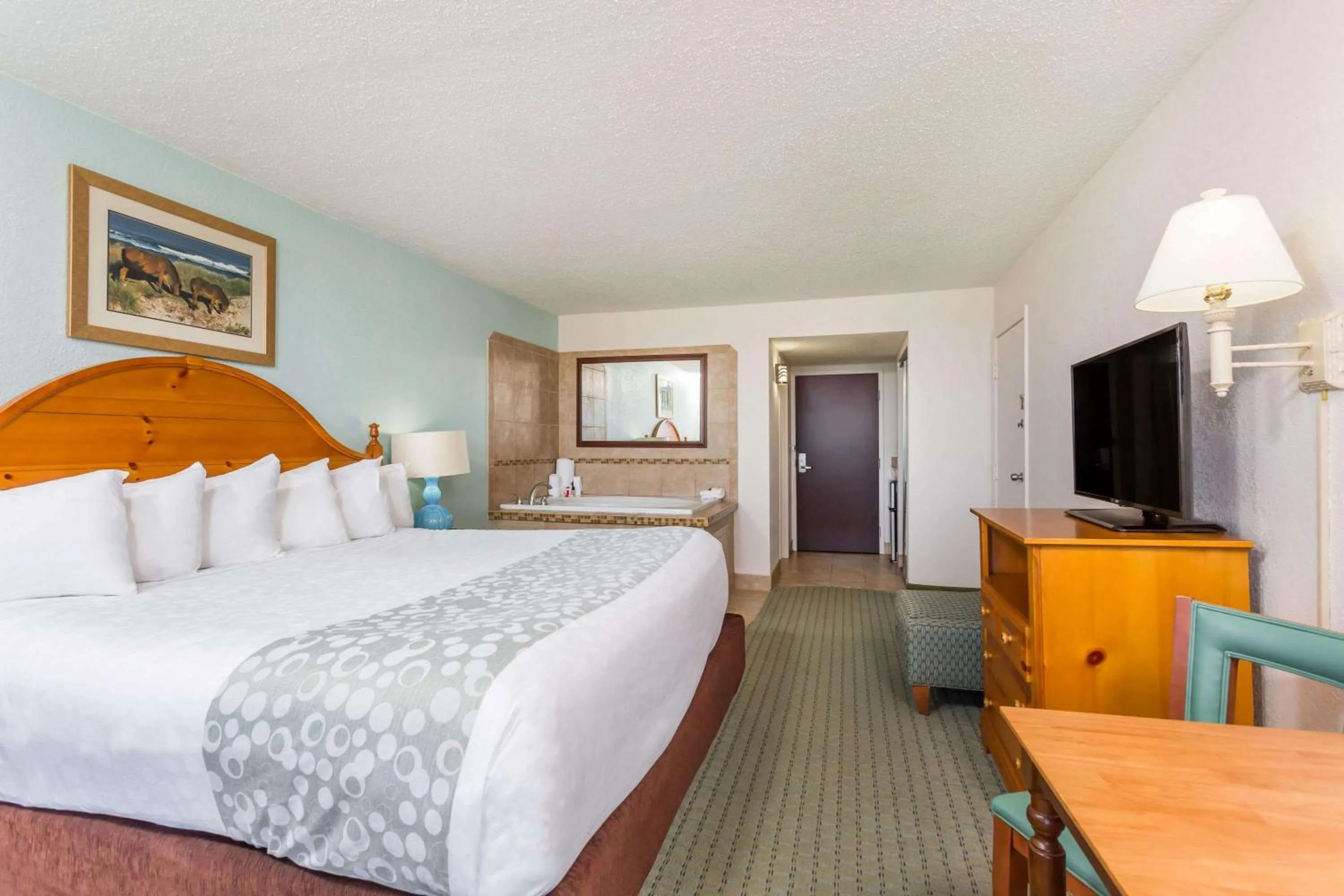 Photo of the whole room, Bed in Ramada Plaza by Wyndham Nags Head Oceanfront