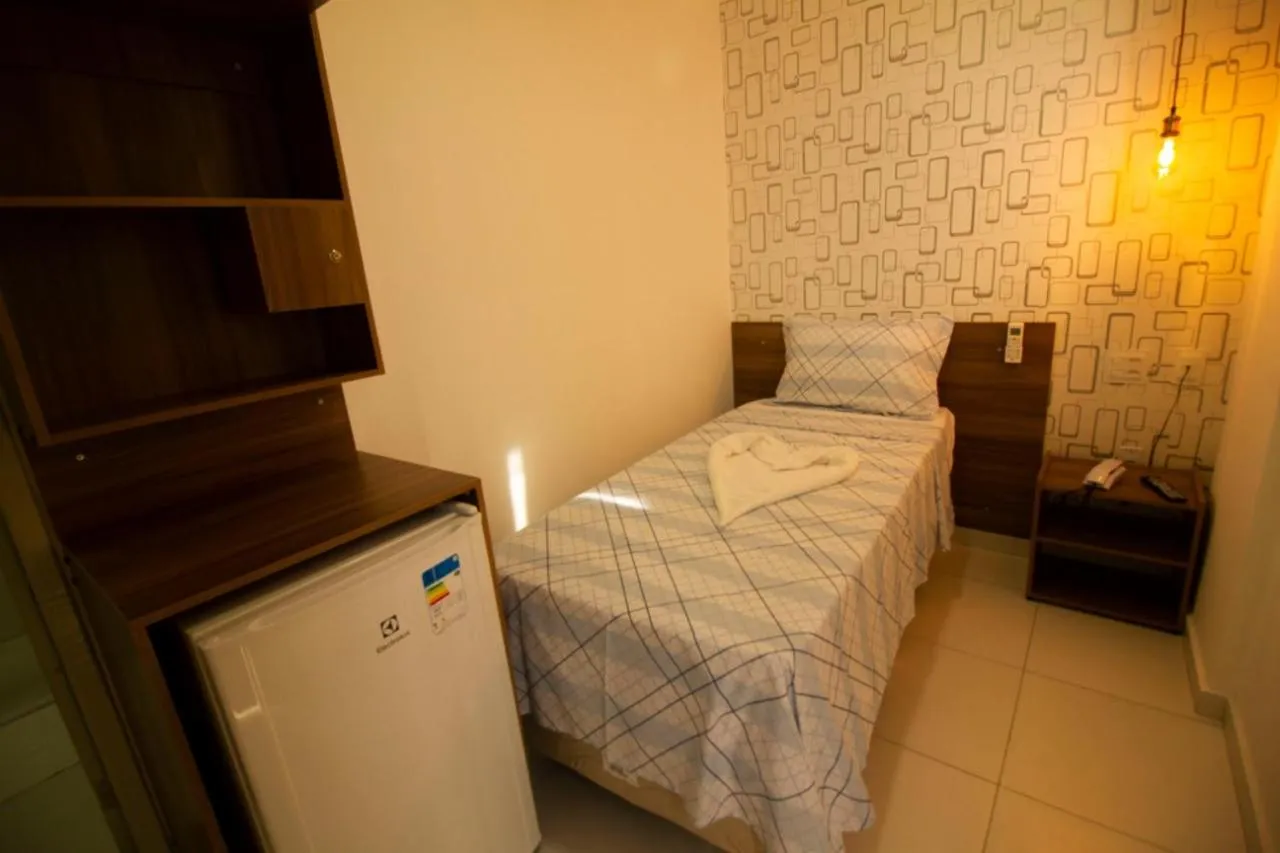 Bed in Pousada Aliança