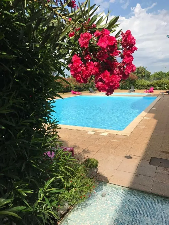 Swimming pool in Hôtel Residence Les Aiguades