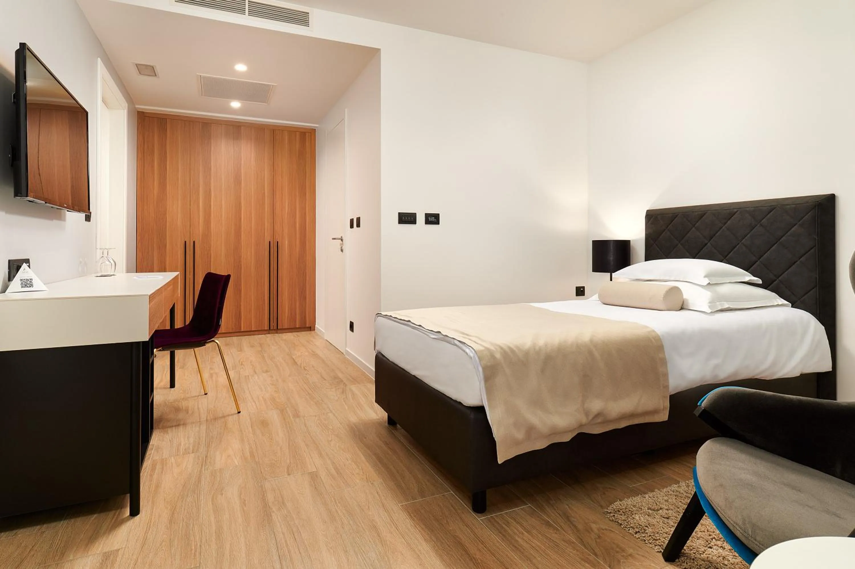 Bed in Amphora Hotel