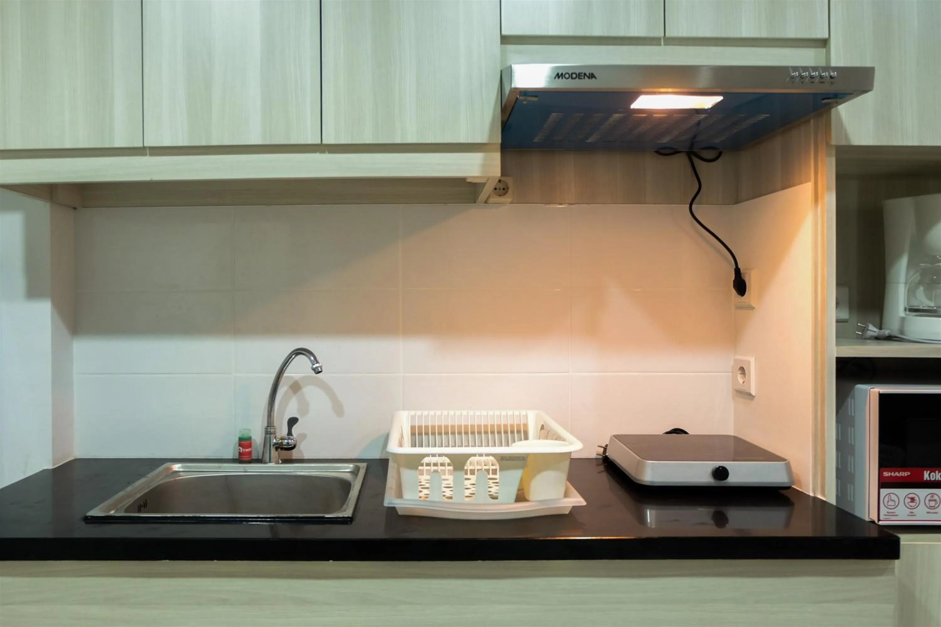 Studio Room Azalea Suites Apartment By Travelio