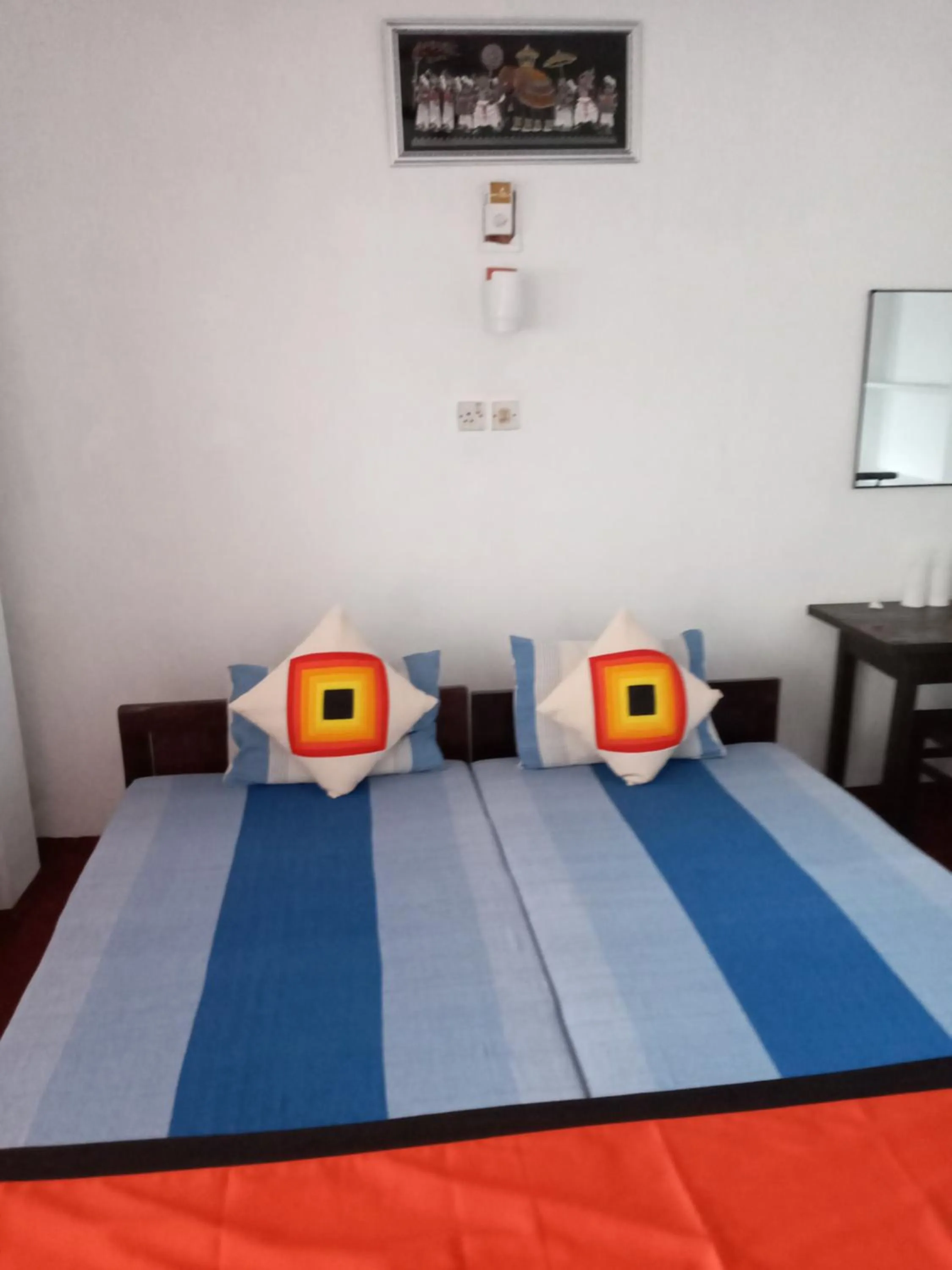 Bed in New SeaSide Inn Hikkaduwa