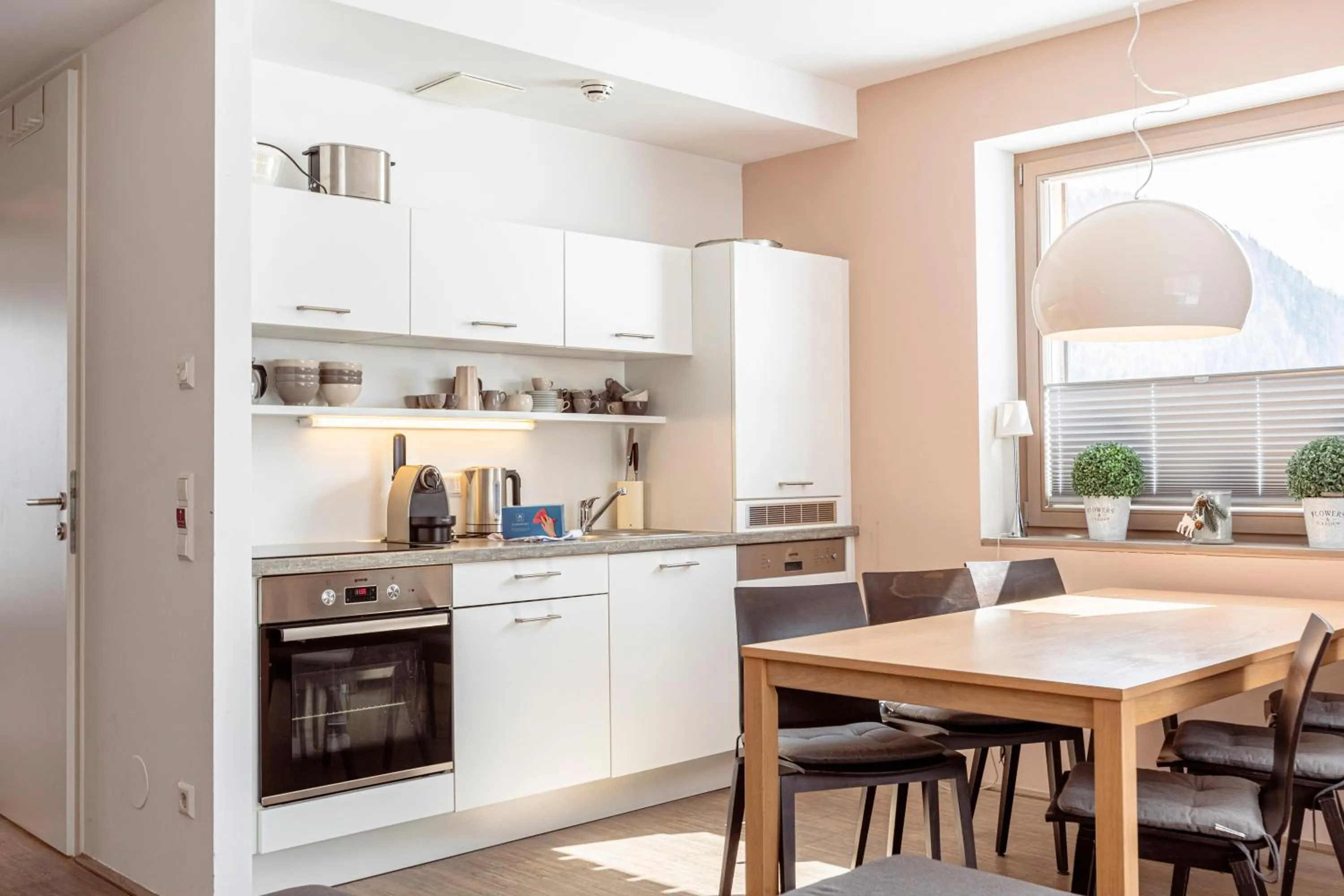 Kitchen or kitchenette in Alpenrock Schladming by ALPS RESORTS