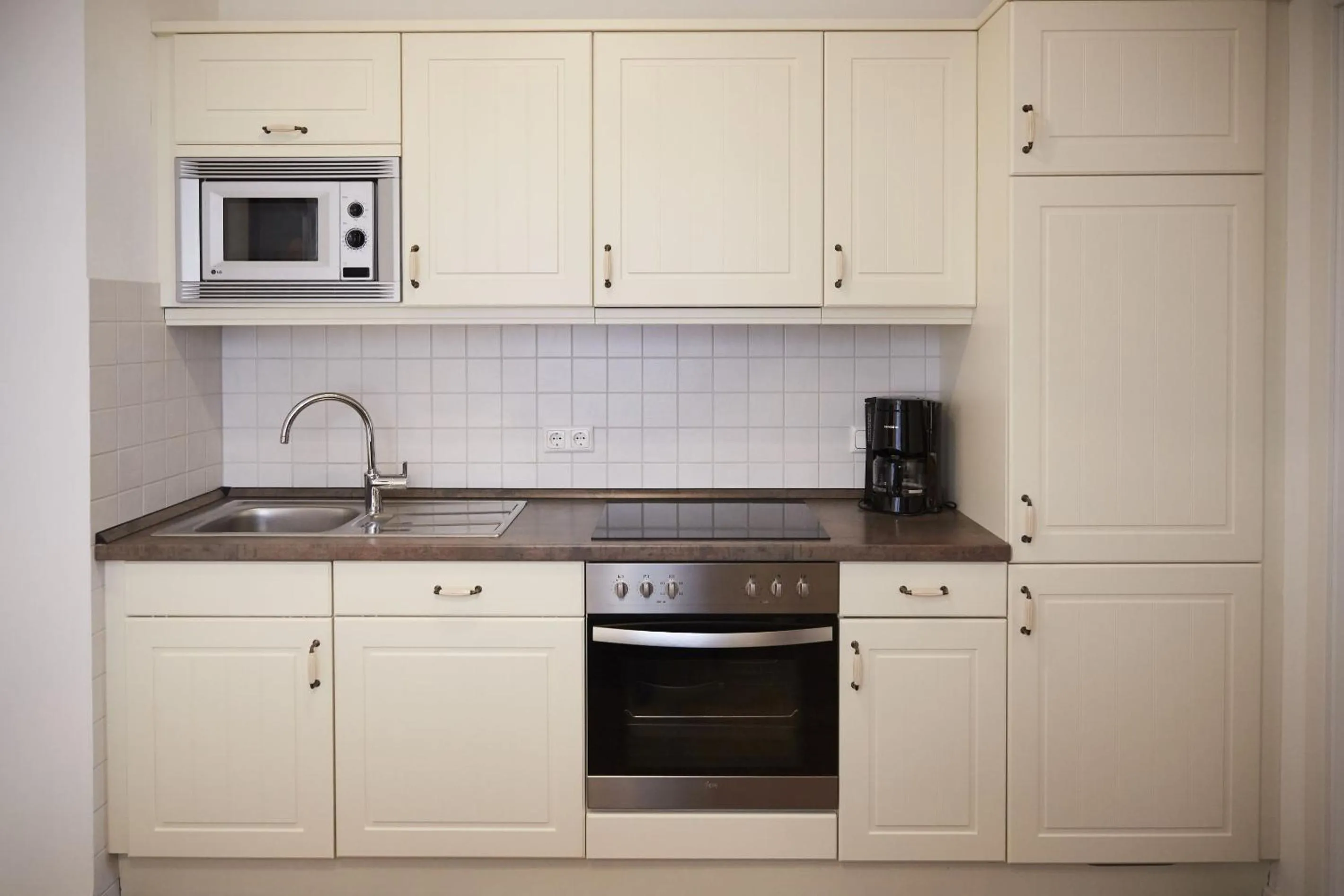 Kitchen or kitchenette in Aparthotel Bernstein